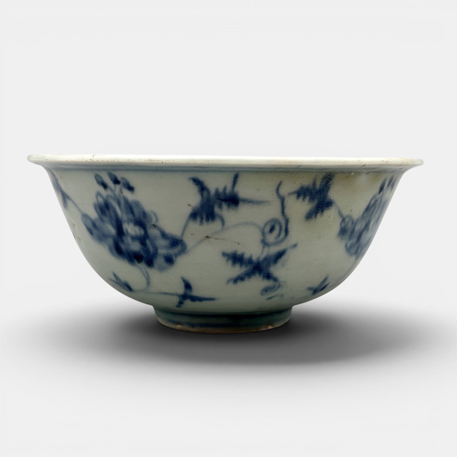 Ming Blue and White Bowl: Middle Ming, with sparsely decorated body of flowers and foliage. Ht. 2.5", diameter 5.5".