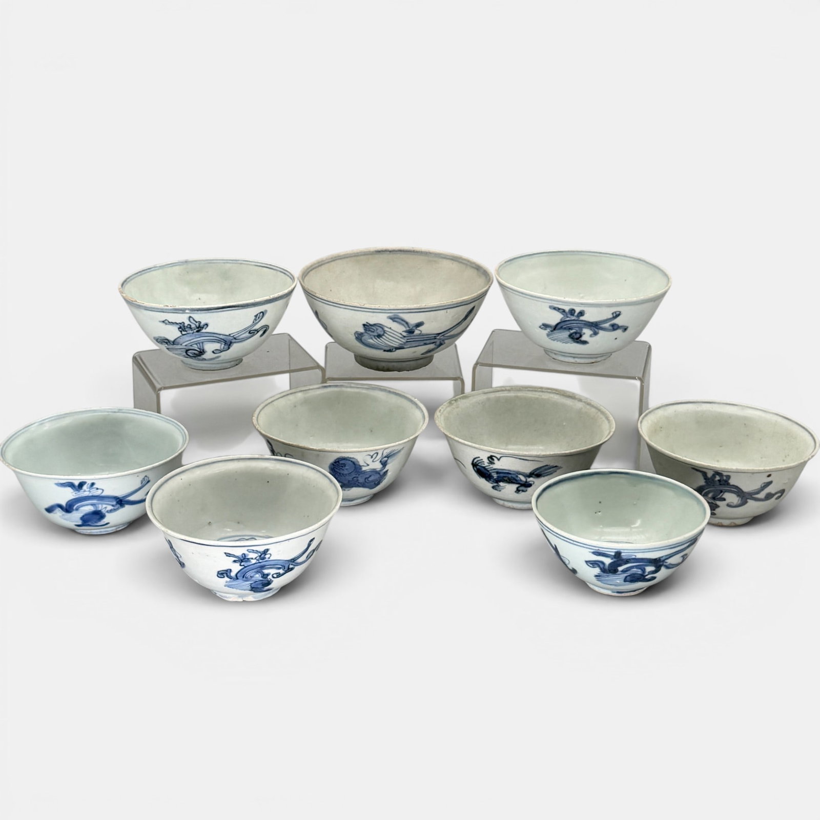 Collection of 9 Ming Blue and White Bowls: A nice collection of nine bowls, each with similar beast design to exterior. Largest 2.75" ht., diameter 6".