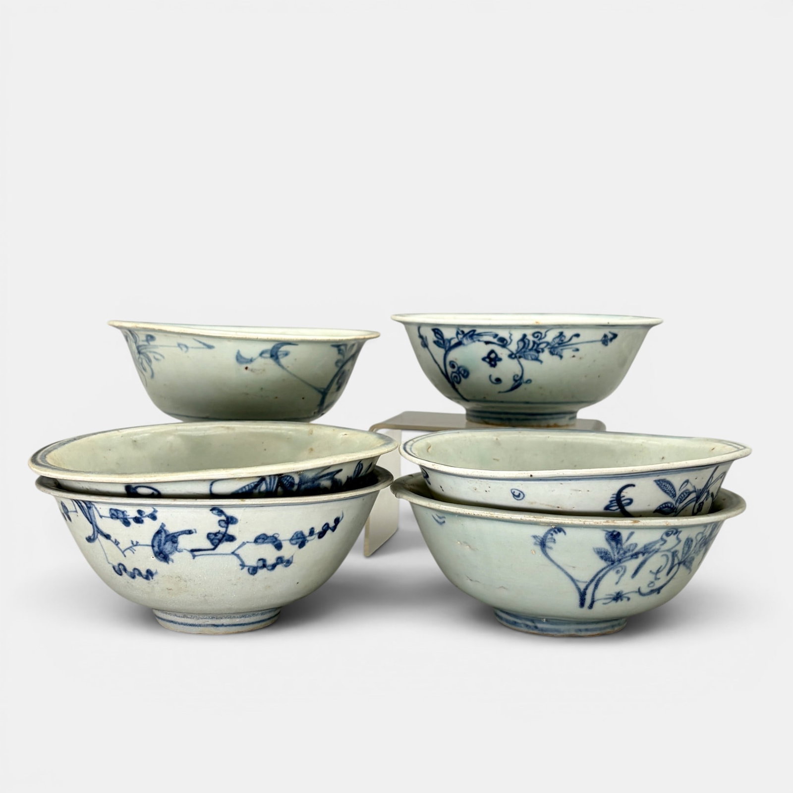 Large Collection Ming "Bird and Branch" Bowls: All Ming period, and each in similar decoration with a single branch, some with a bird perched. 12 examples in total. Each approximately 2.5" ht., diameter 6".