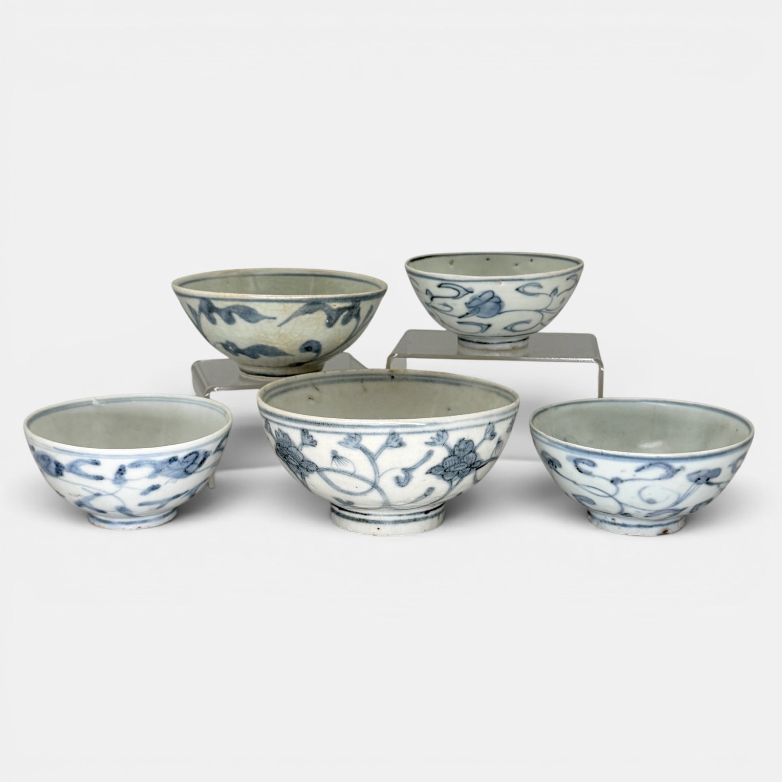 5 Ming Blue and White Bowls: All Ming, bowls of a slightly smaller stature, each with flower and vine decoration. Largest ht. 2.75", diameter 5".
