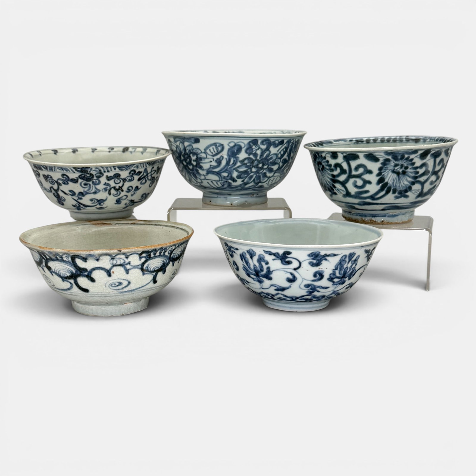 Five Ming Blue and White Bowls: 5 Ming period bowls, varying designs of clouds, floral and foliage. Largest 3", diameter 6.25".