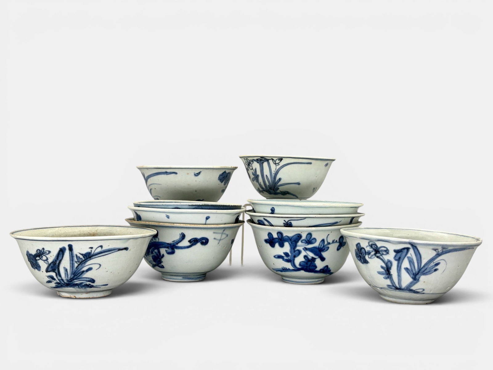 Collection of 10 Ming Blue and White Bowls: Each Ming period, all with similar decoration of a single flowering plant. Each approximately 2.25" ht., diameter 5".