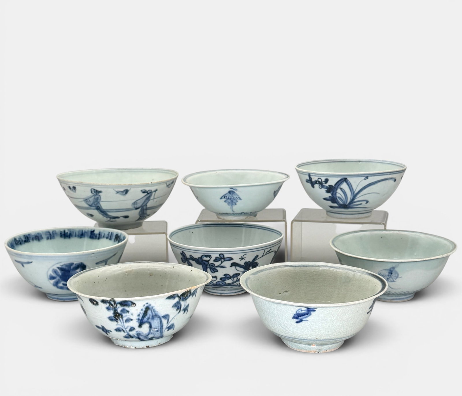 8 Ming Blue and White Bowls: Each Ming period, including one larger (Ht. 3", diameter 7.25") example with figures in the surround.