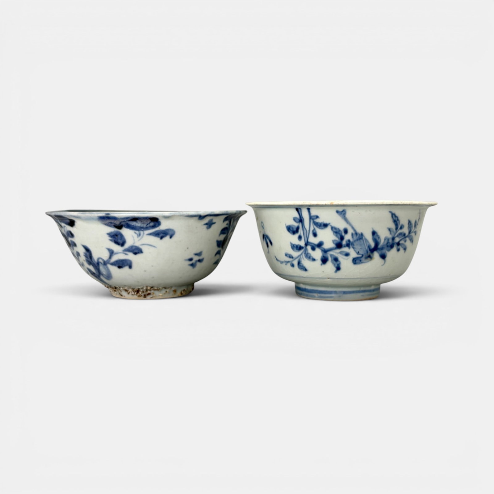 Pair of Ming Blue and White Bowls: Each with branching or flowing simplistic design. Ht. of each 2.5", diameter 5.25".