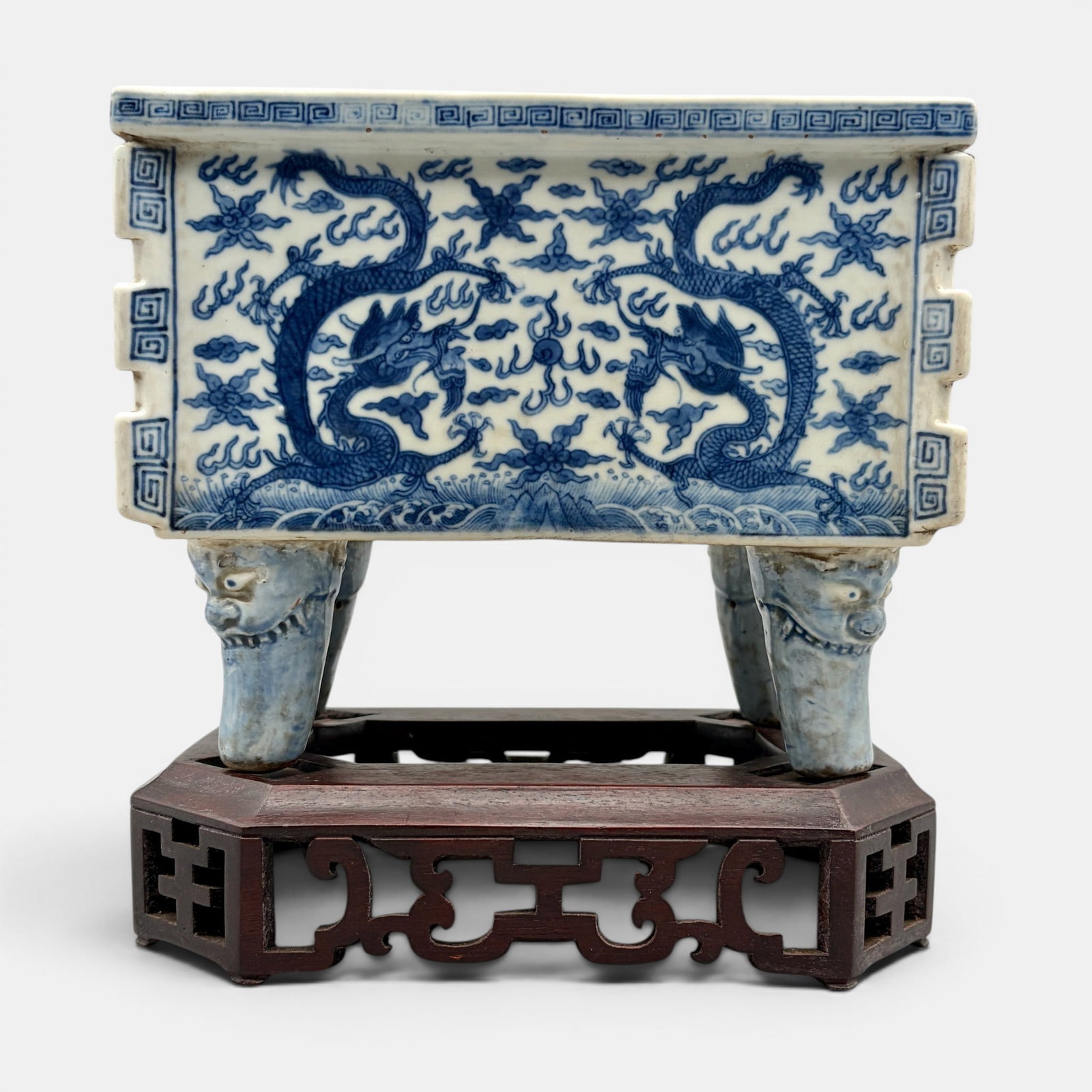 Interesting Blue and White Planter, Jiajing Mark: Jiajing (Ming) six character mark to the rim of the planter, though this example may be 19th century. A blue underglaze decorated planter with dragons to all four exterior panels, archaic scrollwork t