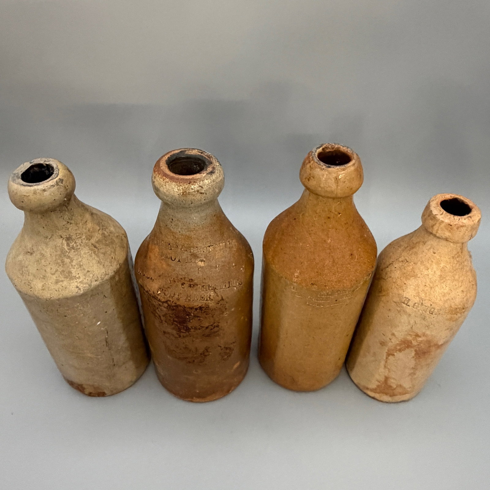 Four early ceramic bottles for various substances. - 6