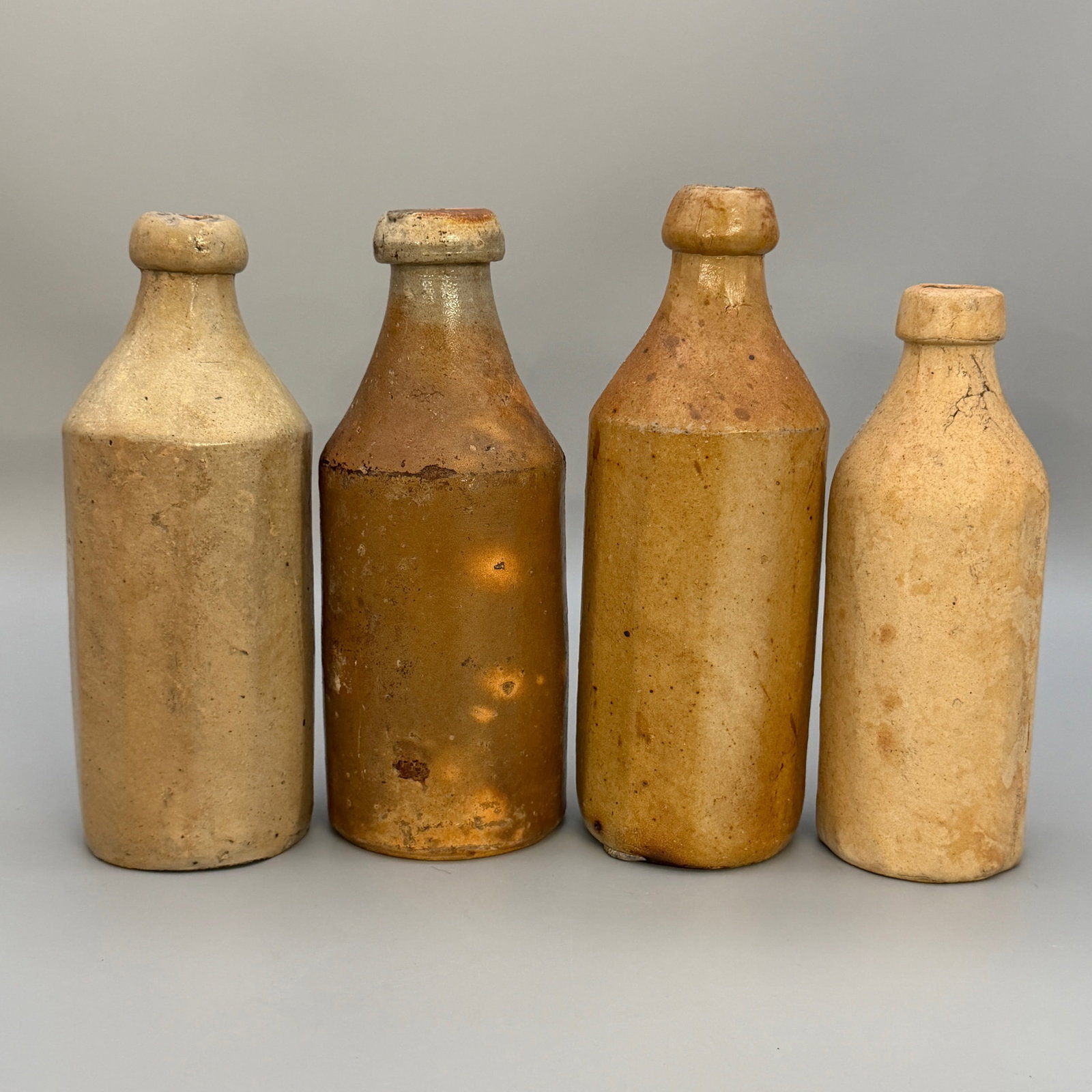 Four early ceramic bottles for various substances. - 7