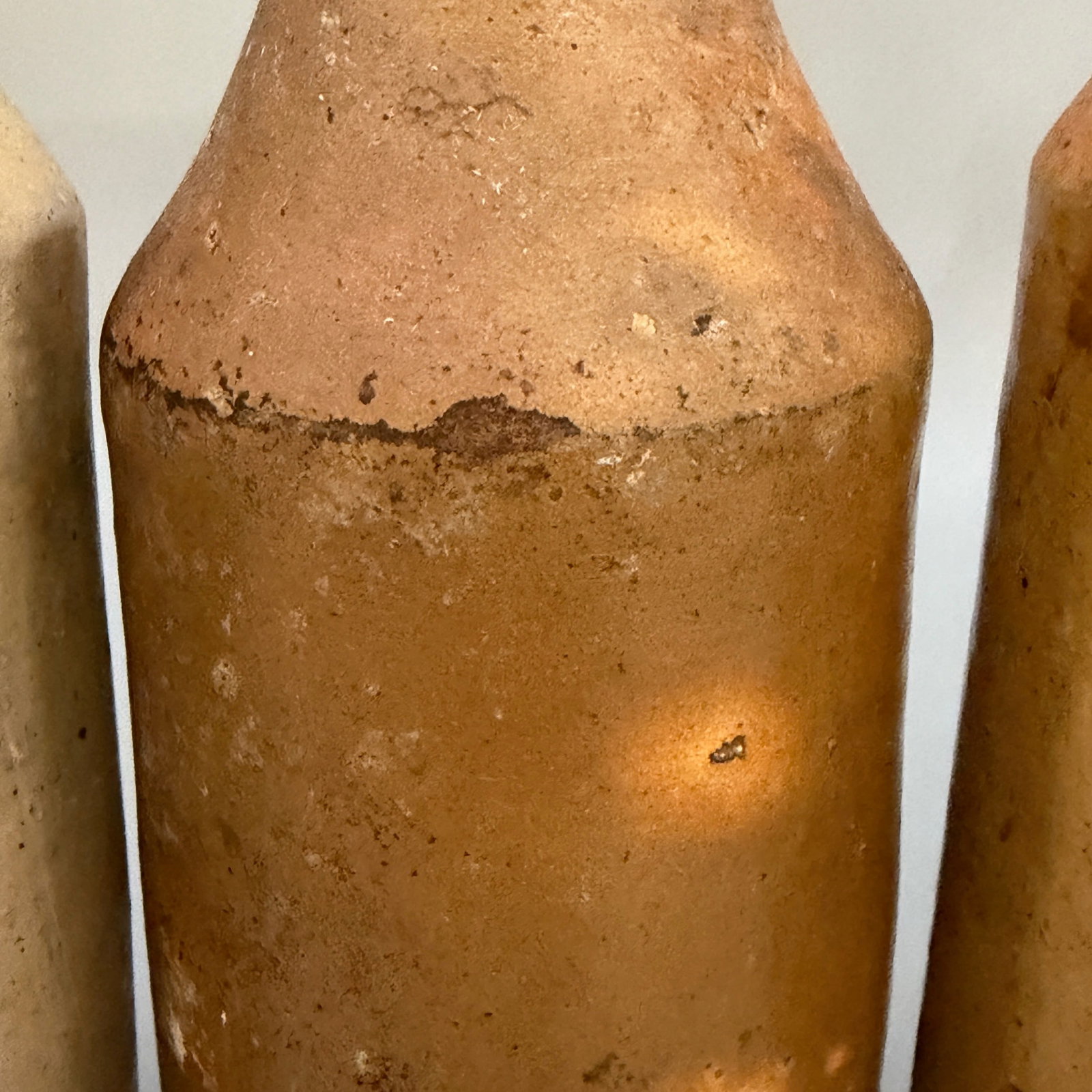 Four early ceramic bottles for various substances. - 8