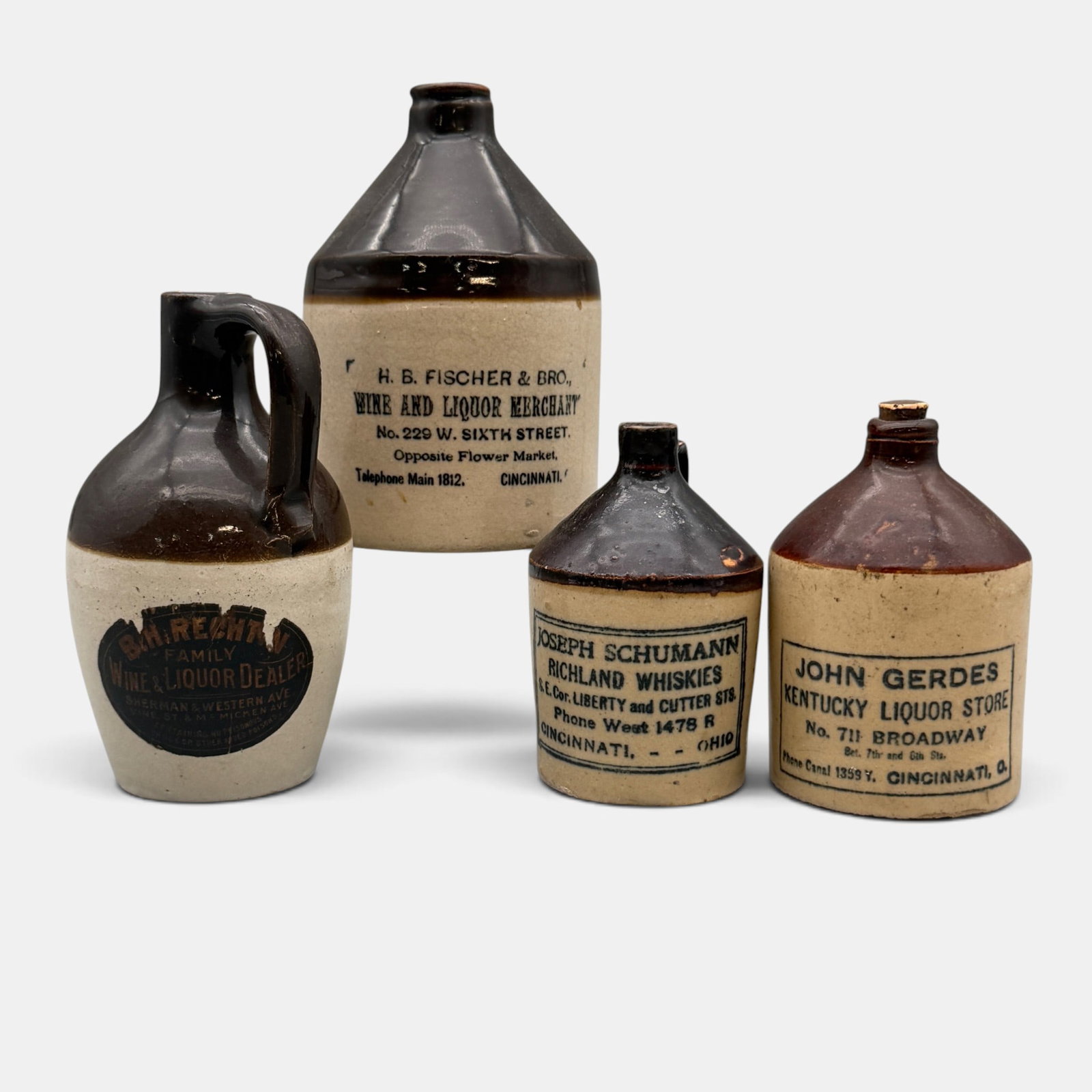 Four small two tone miniature whiskey jugs. (1 of 16)