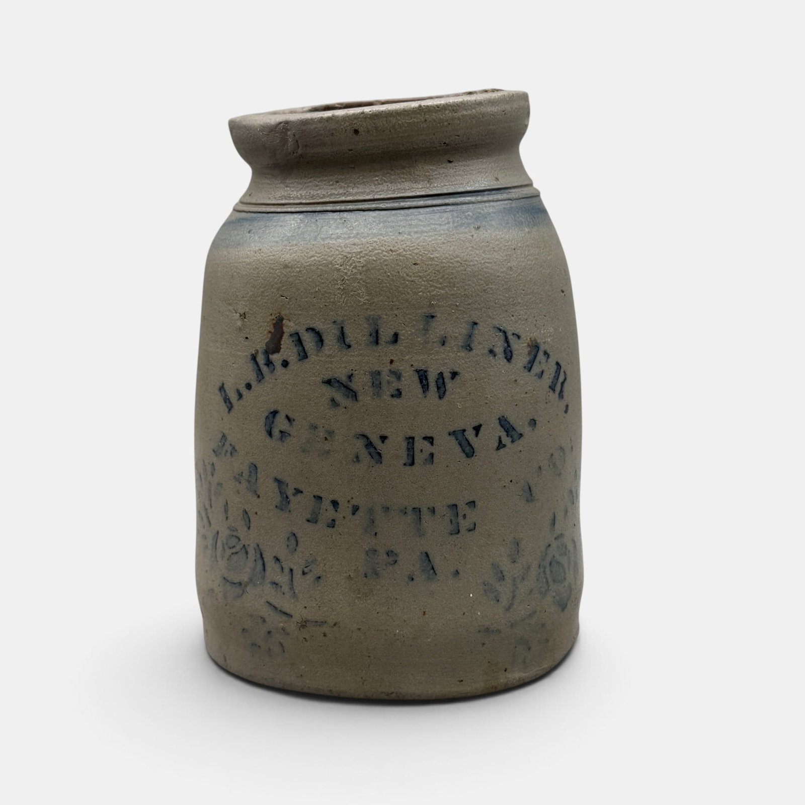 L.B. Dilliner, New Geneva Stoneware storage jar.: L.B. Dilliner, New Geneva, Fayette, PA stoneware storage jar with cobalt blue floral decoration and lettering. Height: 9 1/2 inches. From the Jerry Stehlin Collection.