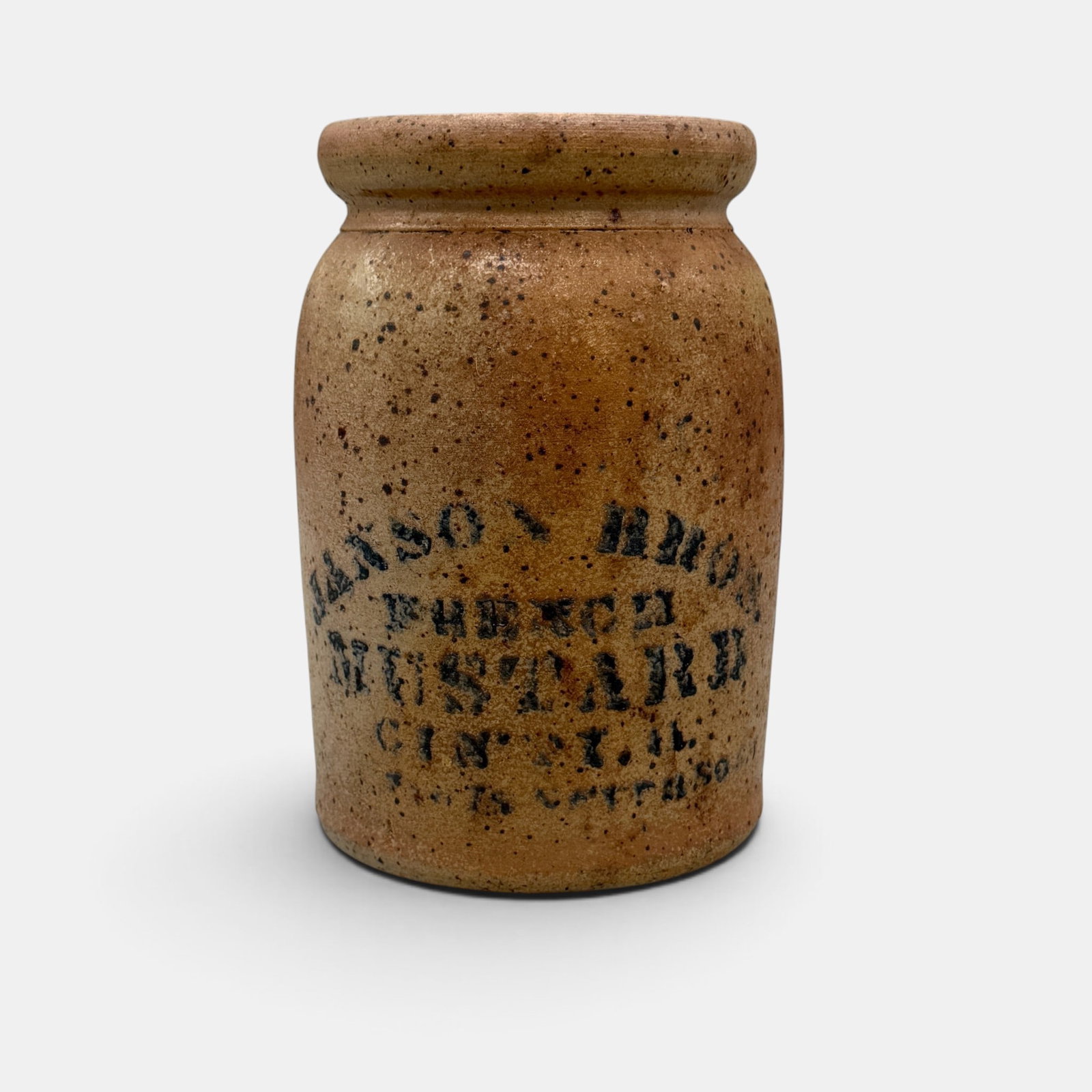 Storage jar with speckled glaze, Janson Bros French Mustard, Cincinnati: Storage jar with speckled glaze stenciled "Janson Bros. French Mustard Cin'ti O. Line below is difficult to reat. Height 8 1/8 inches, diameter 5 1/4 inches. From the Jerry Stehlin Collection.