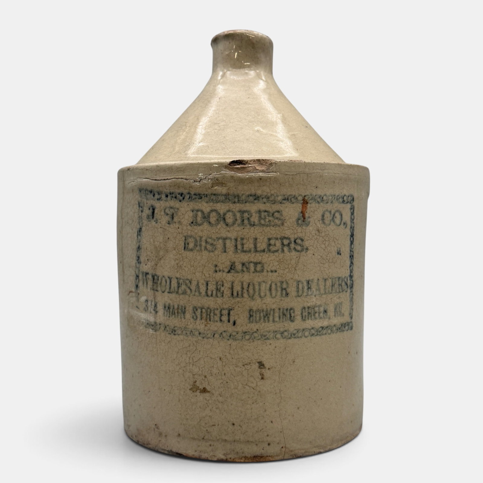 Whiskey jug, J.T. Doores and Co. Bowling Green, KY: Whiskey jug with cobalt lettering, ":J.T. Doores & Co. Distillers and Wholesale Liquor Dealers, 314 Main Street, Bowling Green, KY. Height 9 1/2 inches. From the Jerry Stehlin Collection.