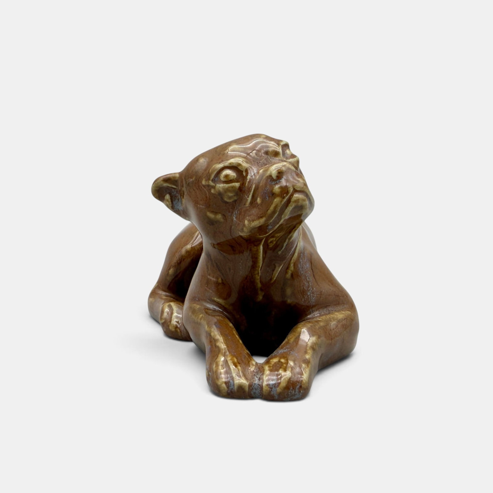Rookwood "Laying Down Butch" PW, 1934: Uncommon "Laying Down Butch" paperweight, a Louise Abel design also featuring E.T. Hurley's bulldog. Impressed Rookwood logo, XXXIV, Shape number 6481 along with Abel's cast monogram. Height 2 1/2 inc