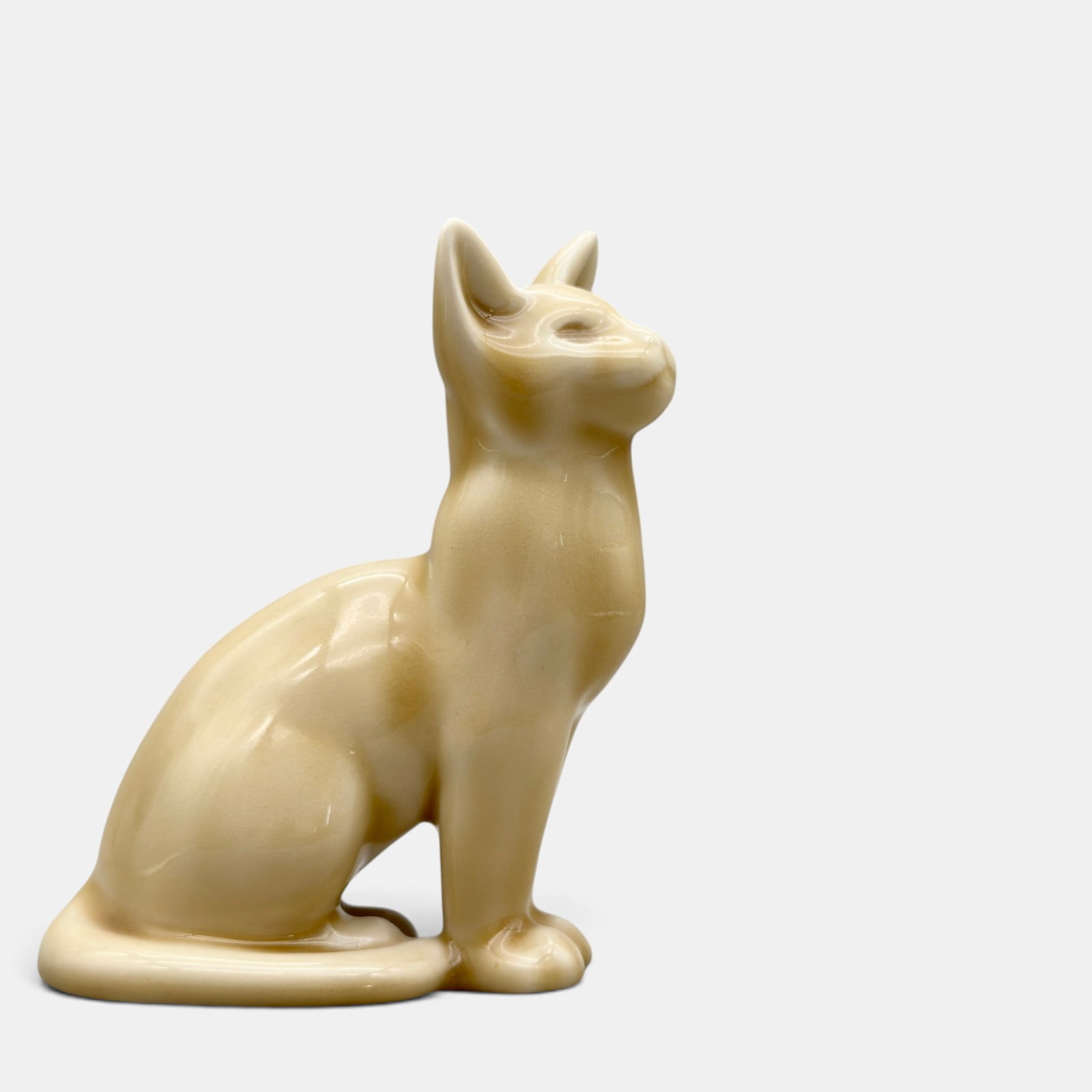 Rookwood Cat paperweight, 1946: Rookwood Cat paperweight, a Louise Abel design, done in a tan high glaze in 1946. Impressed Roowood logo, XLVI, Shape number 6182 along with Abel's cast monogram. Wheel ground line.