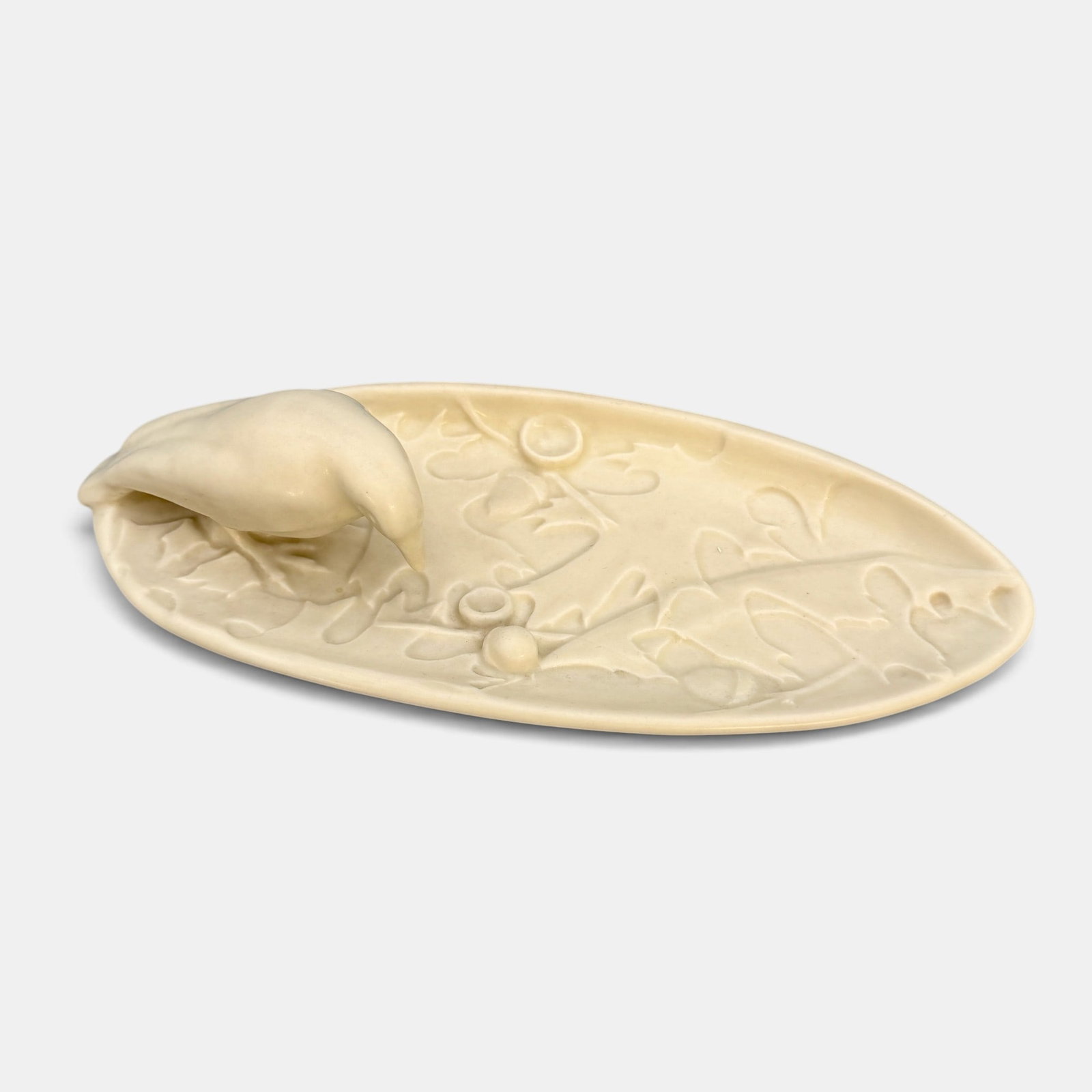 Rookwood "Rook" and Acorn tray, 1937: Uncommon Rookwood "Rook" anc acorn tray in white mat glaze. Impressed Rookwood logo, XXXVII, Shape number 2040. Height 2 1/2 inches, length 10 3/8 inches.