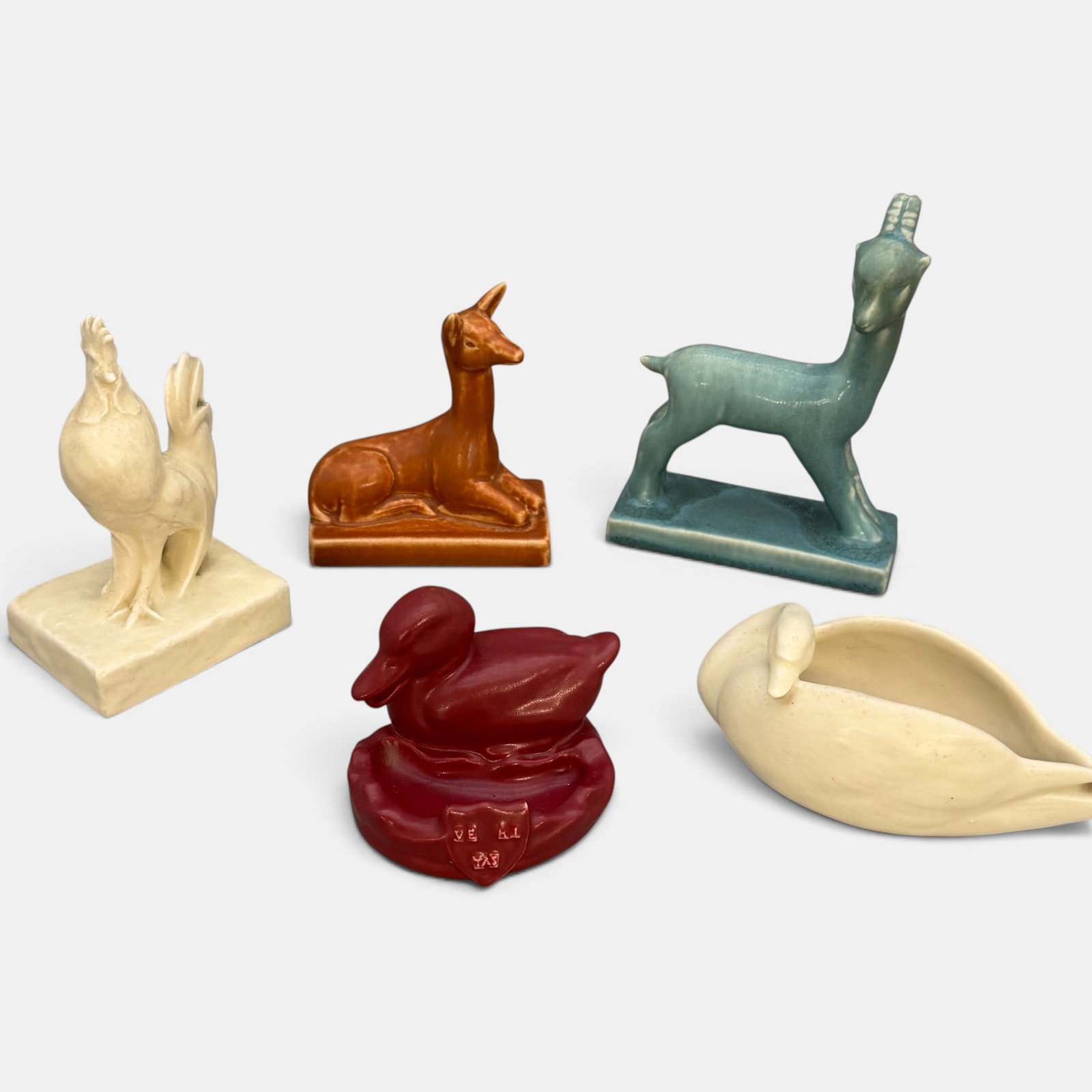 Five Rookwood animal paperweights: Five Rookwood Animal paperweights including Goat 1945, Gazelle 1936, Swan 1934, Rooster 1928 and Harvard Duck 1929. Different colors and dates but all with impressed Rookwood logo. Talest 5 7/8