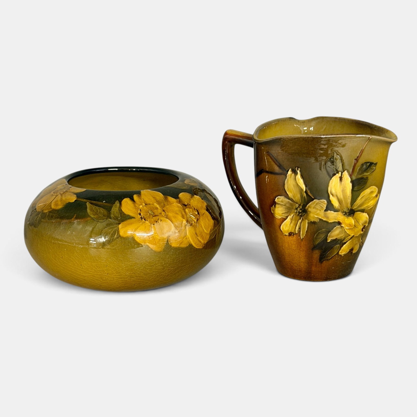 Two Rookwood Standard glaze items, bowl and pitcher: Two Rookwood Standard glaze items. 1. Bowl with wild roses, Noonan, 1905, Shape number 214 C. 2. Tri cornered pitcher, dogwood, Steinle, 1893, Shape number 259 E. Both with impressed Rookwood logo.