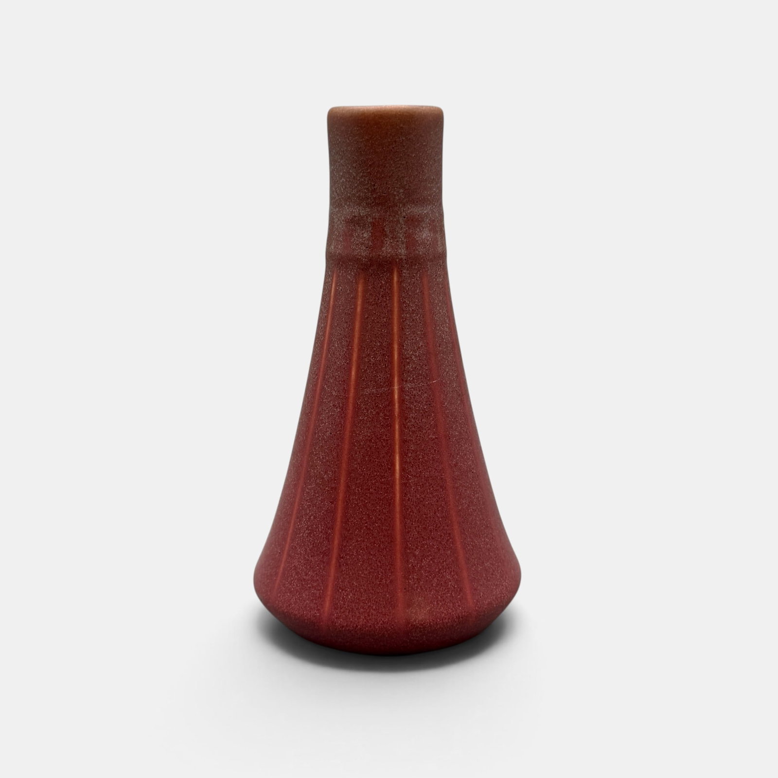 Rookwood Arts & Crafts production vase in rose, 1915: Rookwood Arts & Crafts fluted production vase in slightly crystalline rose mat glaze done in 1915. Impressed Rookwood logo, XV, Shape number 1748. Height 7 inches.