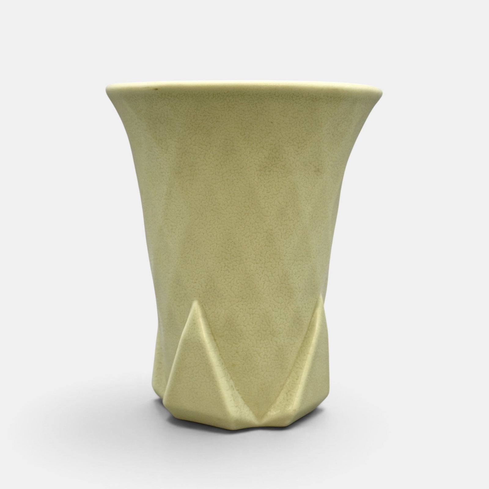 Rookwood production vase, quilted pattern, 1931: Rookwood Art Deco production vase with quilted pattern and four triangle feet done in mat glaze in 1931. Impressed Rookwood logo, XXXI, Shape number 6175. Height 7 inches.