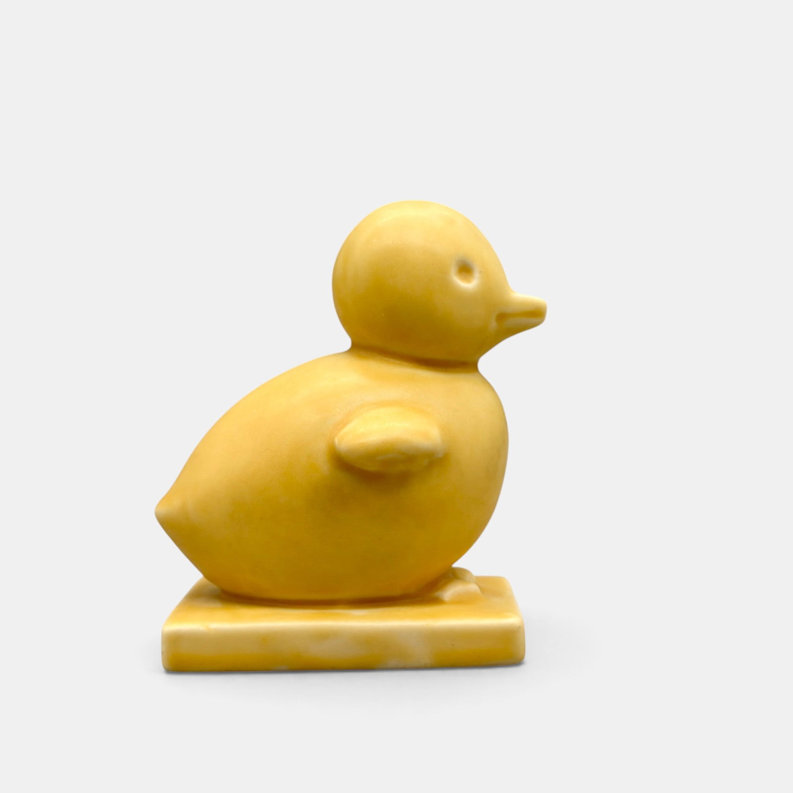 Rookwood Chick paperweight, 1934: Rookwood Chick paperweight, a Louise Abel design, done in yellow mat glaze in 1934. Impressed Rookwood logo, XXXIV, Shape number 6169 and Abel's cast monogram. Height 3 3/4 inches.