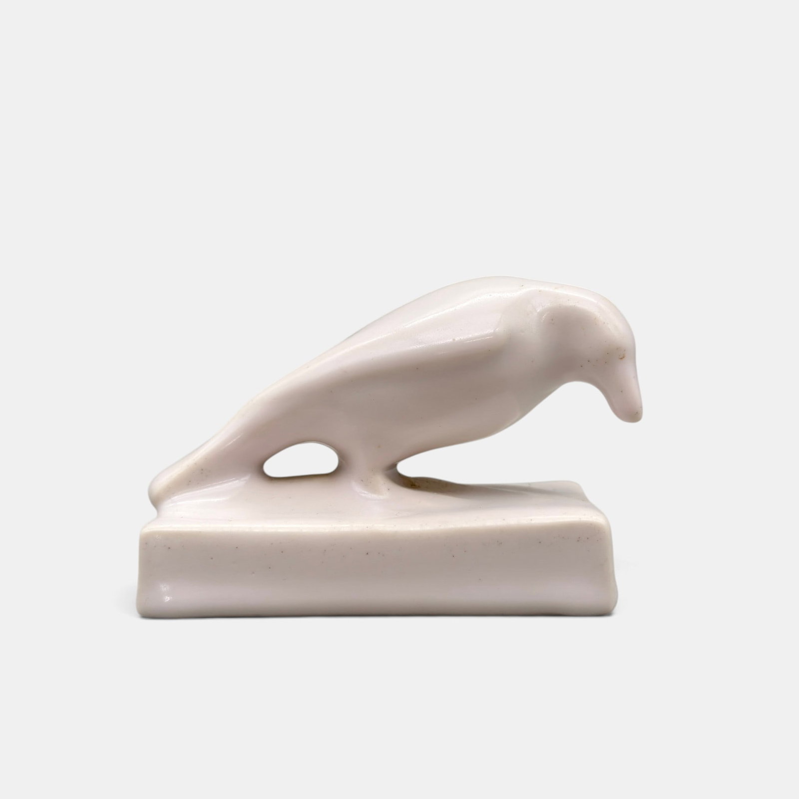 Rookwood Rook paperweight, white, 1936: Rookwood "Rook" paperweight in white mat finish. Inpressed Rookwood, XXXVI, Shape number 1623. Height 2 7/8 inches.