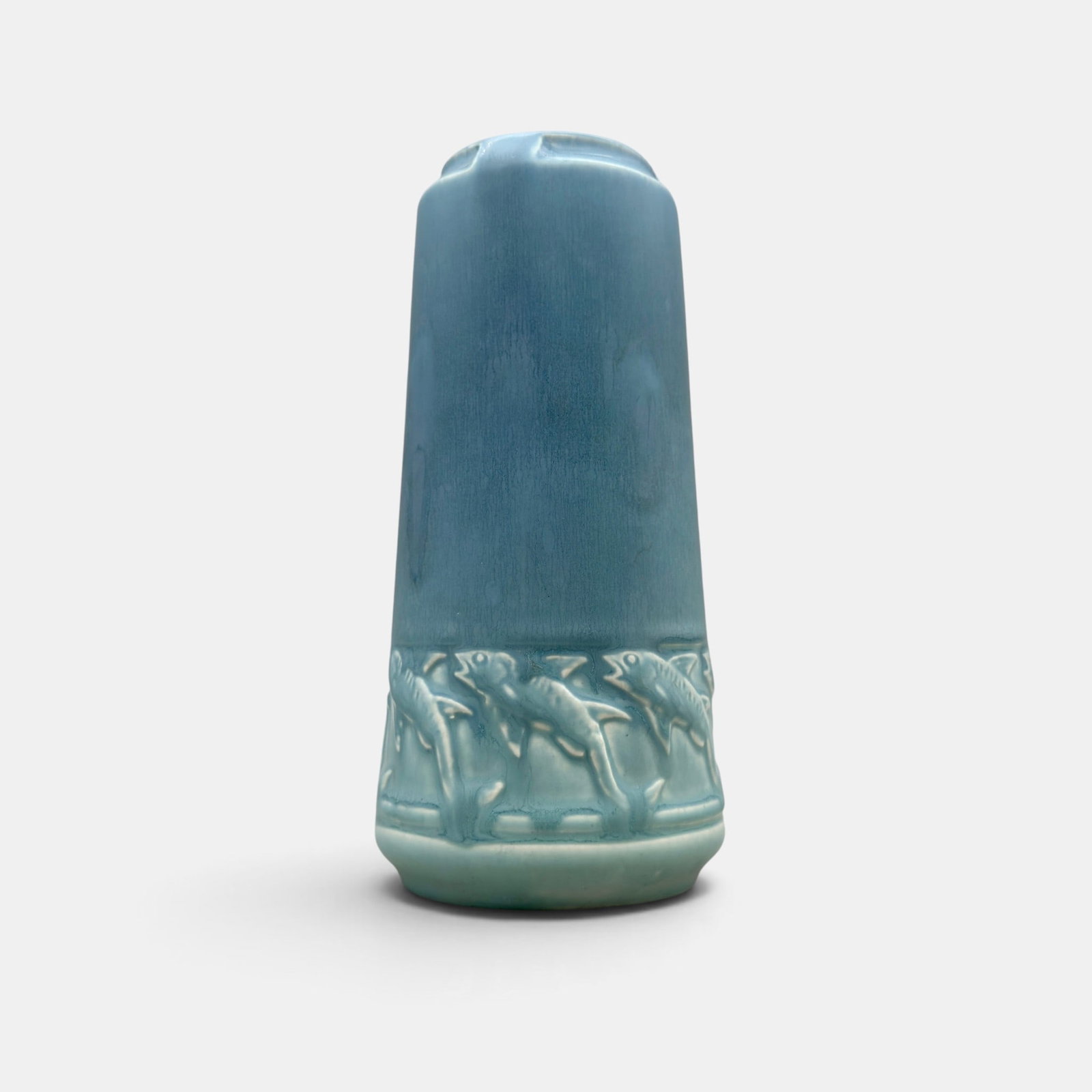 Rookwood blue mat procuction vase, fish, 1920: Rookwood blue production vase with a band of fish around the base, a Albert Munson design done in 1920. Impressed Rookwood logo, XX, Shape number 2323. Height 7 1/2 inches.