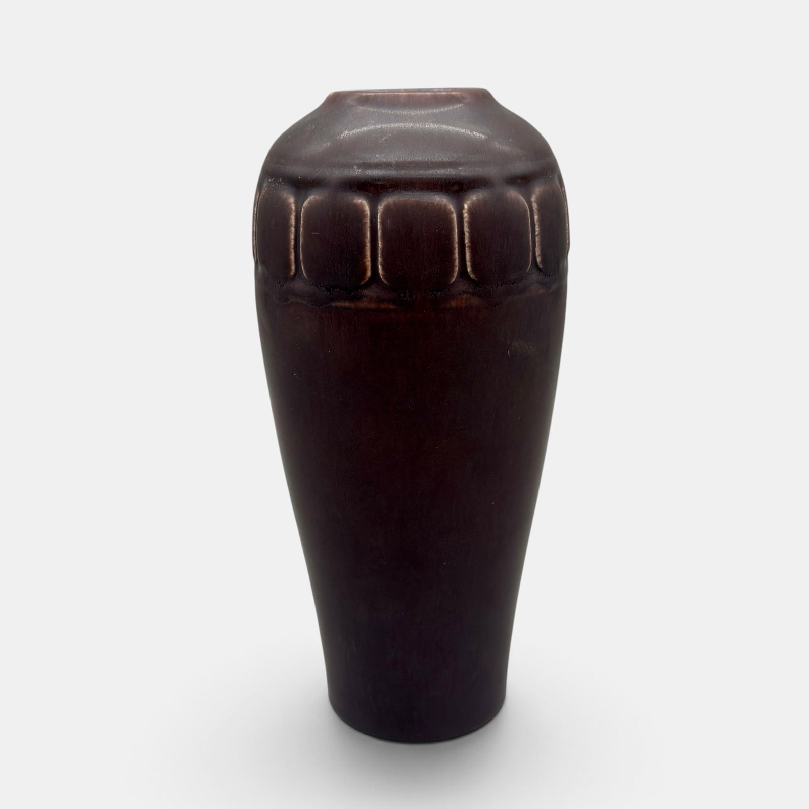 Rookwood deep purple production vase, 1921: Rookwood deep purple production vase with a band of squares on the shoulder, an Albert Munson design done in 1921. Impressed Rookwood logo, XXI, Shape number 2316. Height 8 1/4 inches.