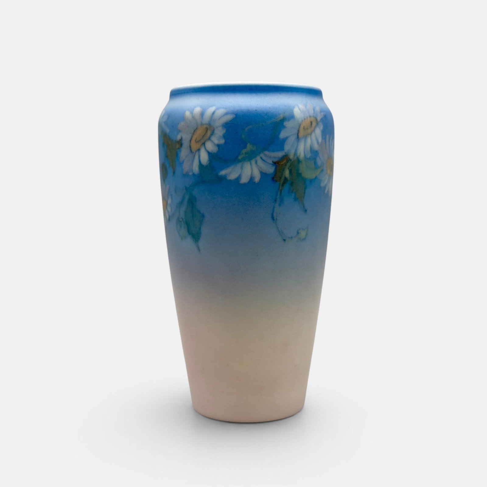 Rookwood Vellum vase with daisies, Rothenbusch, 1928: Crisp Rookwood Vellum vase with daisy decoration by Fred Rothenbusch in 1928. Impressed Rookwood logo, XXVII, Shape number 1369 F. Height 6 1/8 inches.