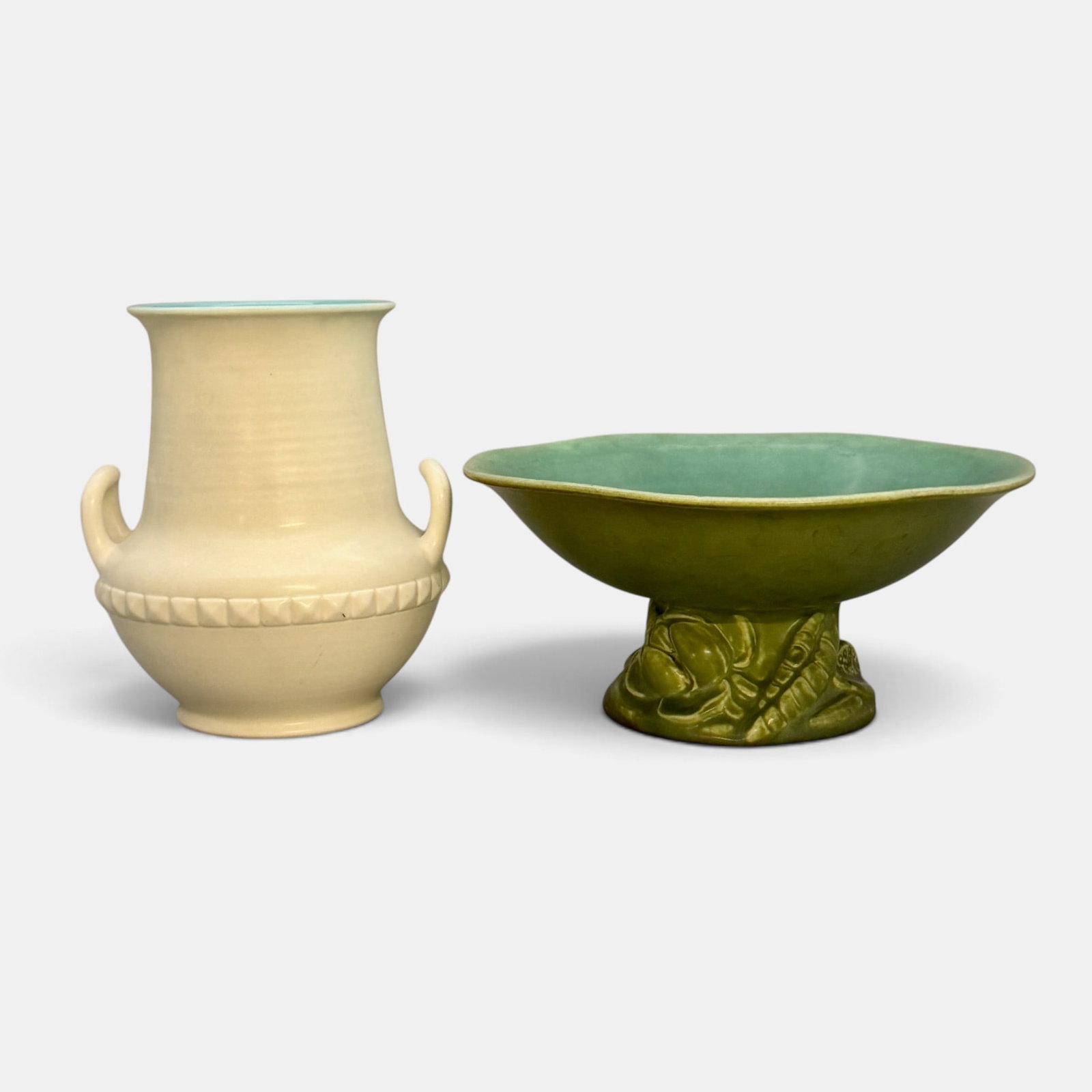 Two Rookwood production items in mat glazes: Two Rookwood production items. 1. Bowl with three dimensional lotus blossoms as its base, a Shirayamadani design done in 1924. Shape 2707. Height 4 1/4 inches, diameter 9 1/2 inches. 2. Vase with two 