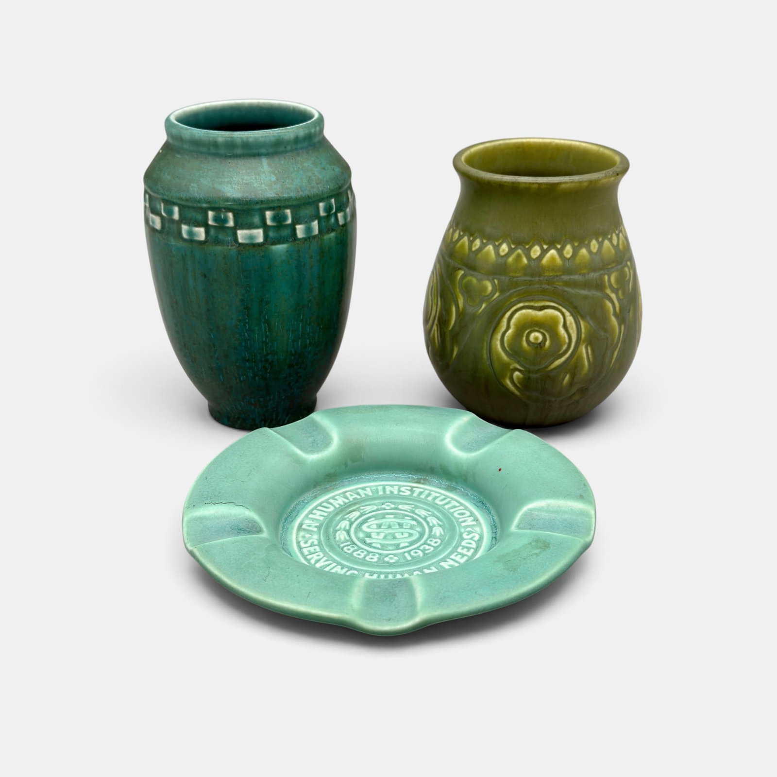 Two Rookwood production items, 2 vases and an ashtray: Two Rookwood production items. Two green mat vases.. Shape 2855 and Shape 2284 both from 1927, with Impressed Rookwood log and date. Height of the tallest 5 1/4 inches.