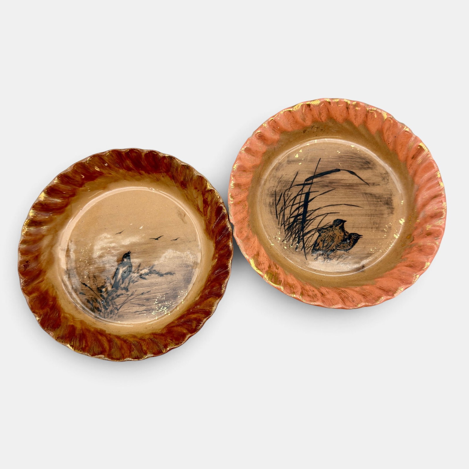 Two Rookwood coupe dishes, birds, 1882: Two Rookwood coupe dishes with bird decoration, one by William McDonald and one by N.J. Hirschfeld.. Both are impessed Rookwood with the date 1882 and have anchor marks. Each is incised with the