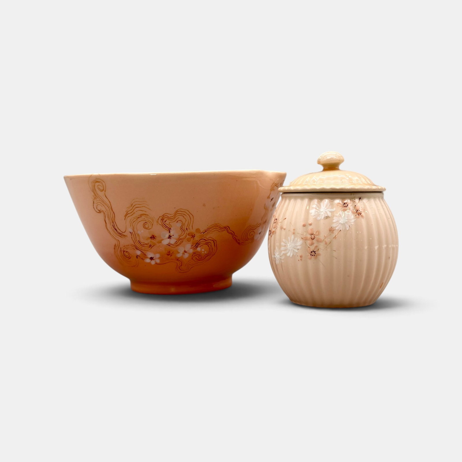 Two Rookwood Cameo glaze items: Two Rookwood Cameo glaze items. 1. Uncommon Mustard jar with cover with small white and pink flowers painted in 1888 by Anna Valentien. Impressed Rookwood logo and two flames, Shape number 396. W for 