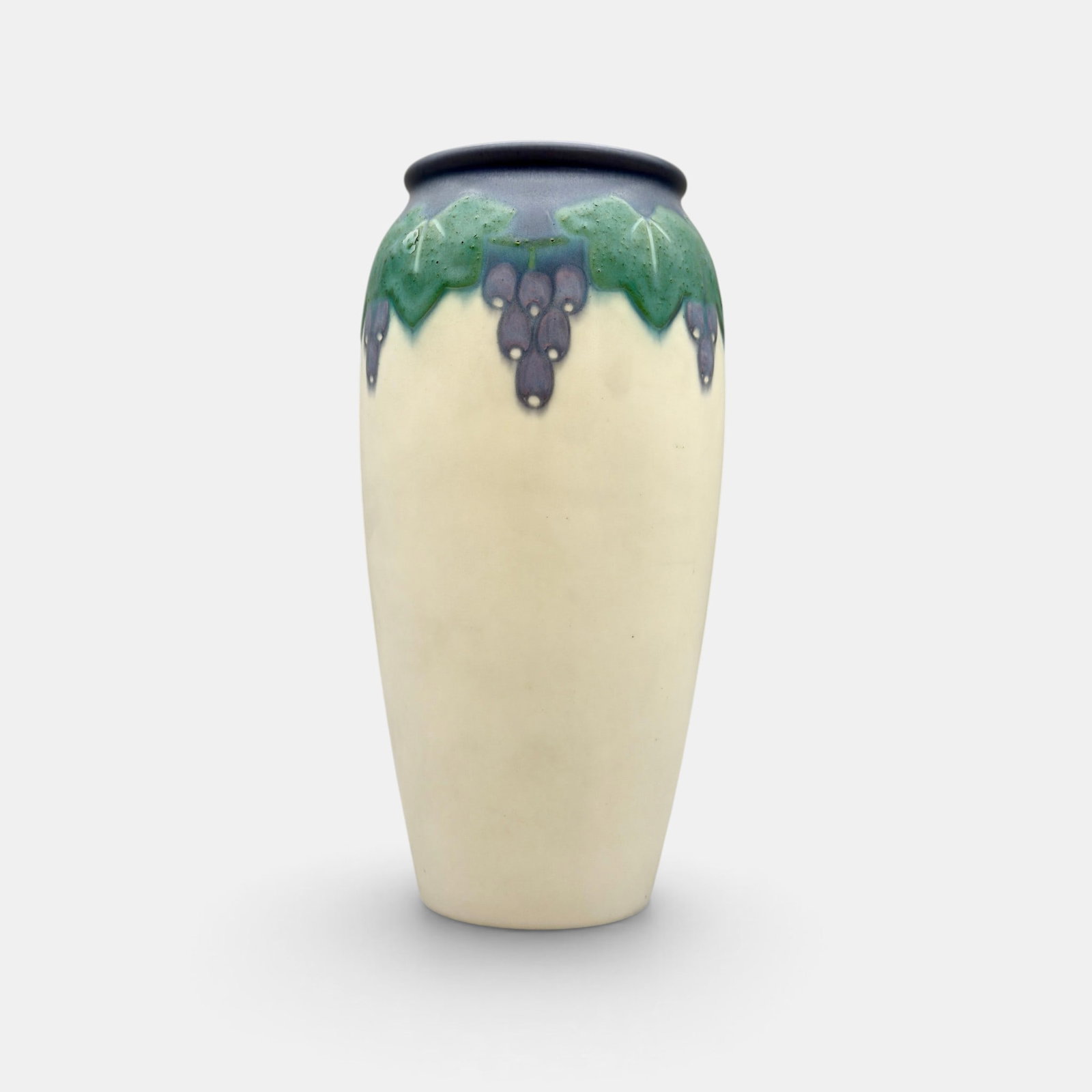 Vellum glaze floral, Van Horne, 1915: Rookwood Vellum glaze vase with leaves and fruit done in 1915 by Katherine Van Horne. Impressed Rookwood logo, XV, Shape number 892 C and Y. Incised V and KVH. Wheel Ground X. Height 9 3/8 inches.
