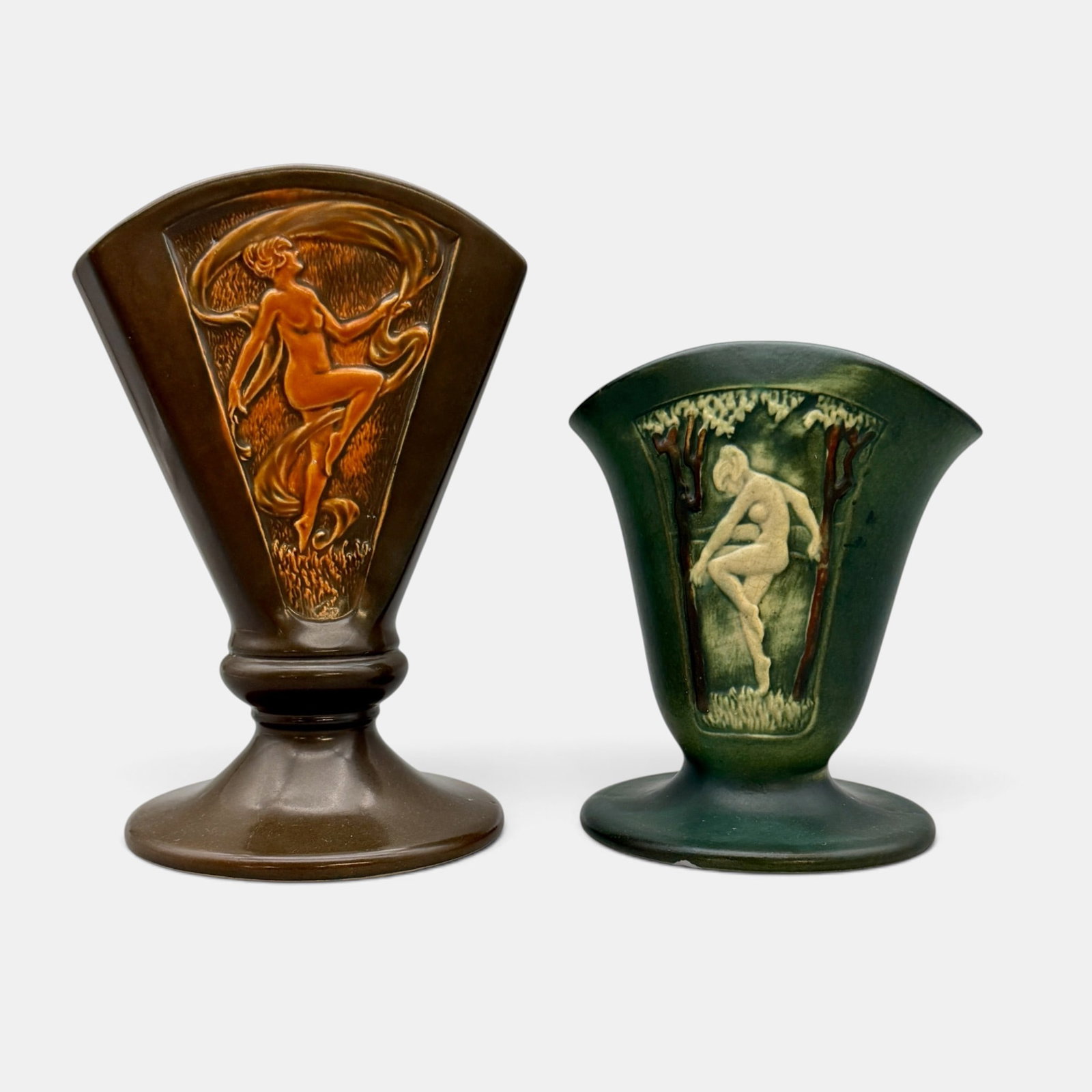 Two Roseville Rosecraft Panel Nudes: Two Roseville Rosecraft Panel vases with nudes, one brown and one green. Both marked with RV inkstamp logo. Height 8 1/2 and 6 3/8 inches.