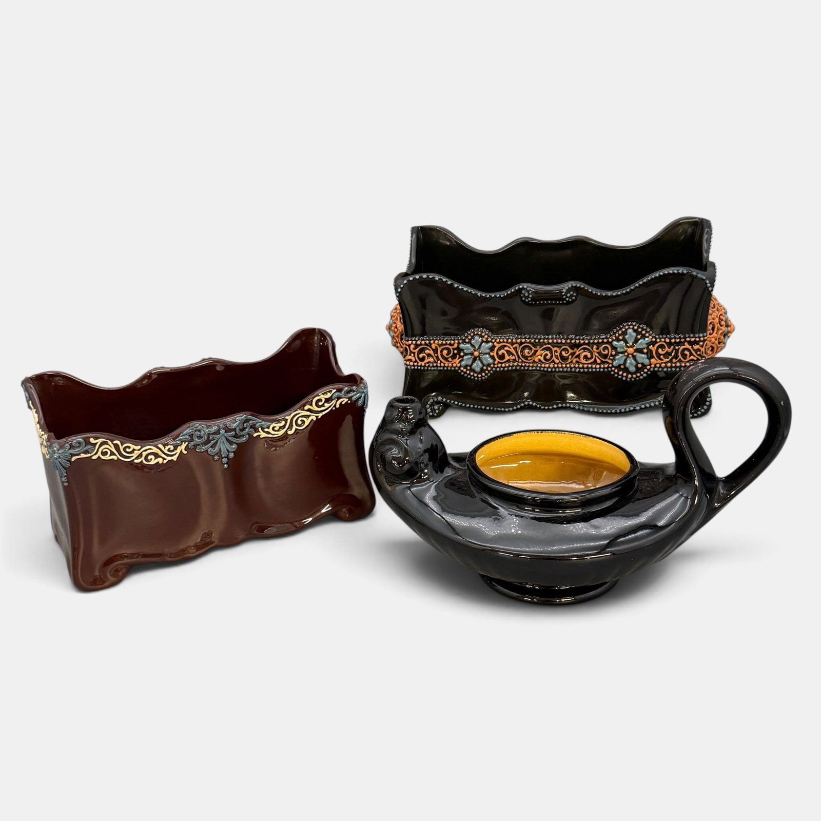 Three Weller Turada items: Three Weller Turada items. 1. Two rectangular letter holders, one with reticulated cabachon, one without. 2. Aladdin's lamp. The lamp and one of the letter holders is marked Turada Weller. Height of