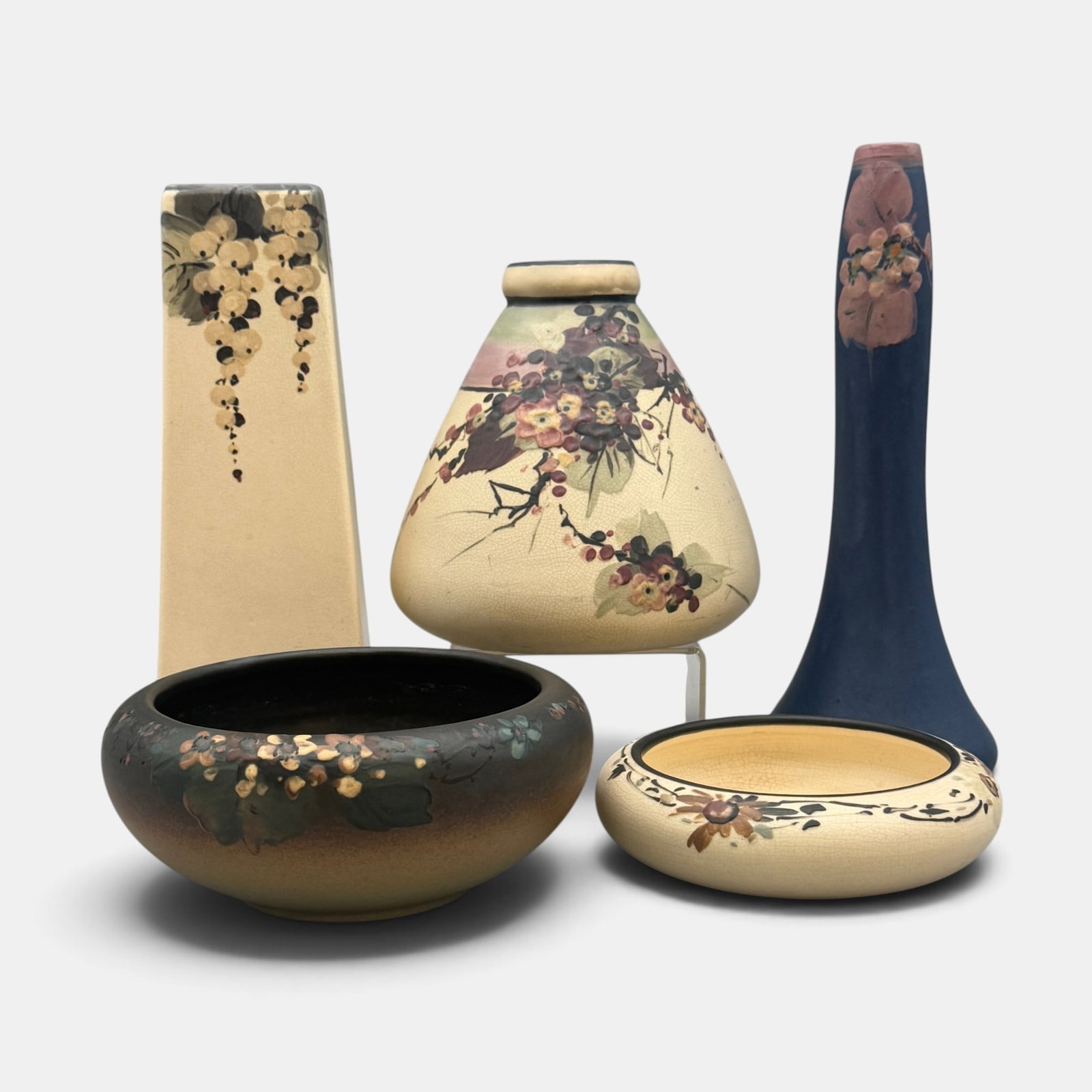 Five Weller Hudson floral pieces: Five Weller Hudson items including three White and Decorated, one Blue and Decorated and one Hudson bowl, all with floral decoration. All marked with Weller impressed in large block letters. Tallest i
