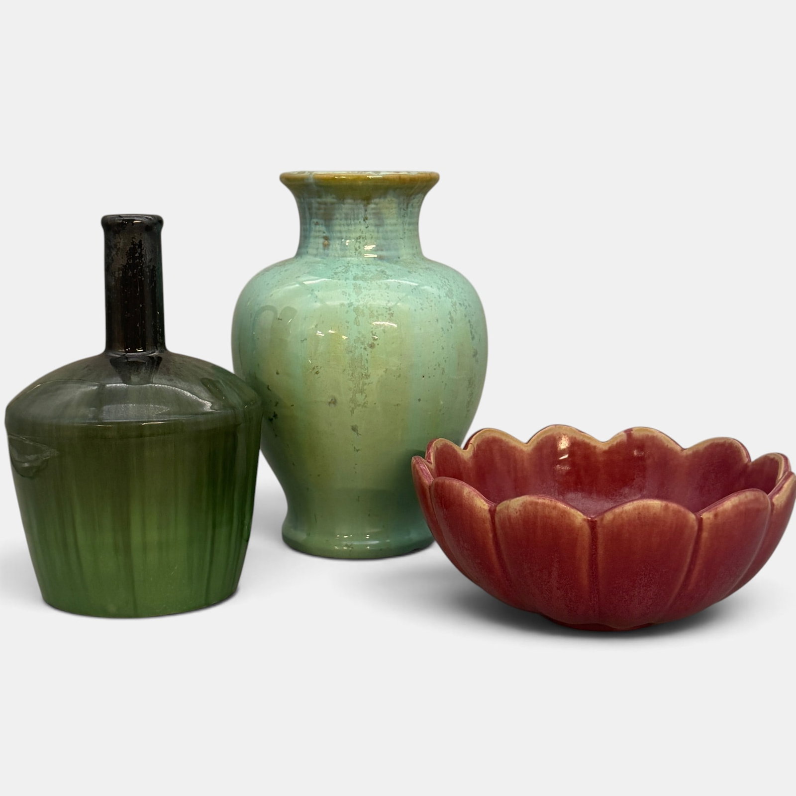 Three Fulper items, vase, bowl and music box jug: Three Fulper items. 1. Flemington Green crystalline vase, 9 3/8 inches tall. 2. Fluted bowl in rose mat glaze, 3 1/4 inches tall. 3. Wiskey jug in crystalline black over crystalline green g;aze with