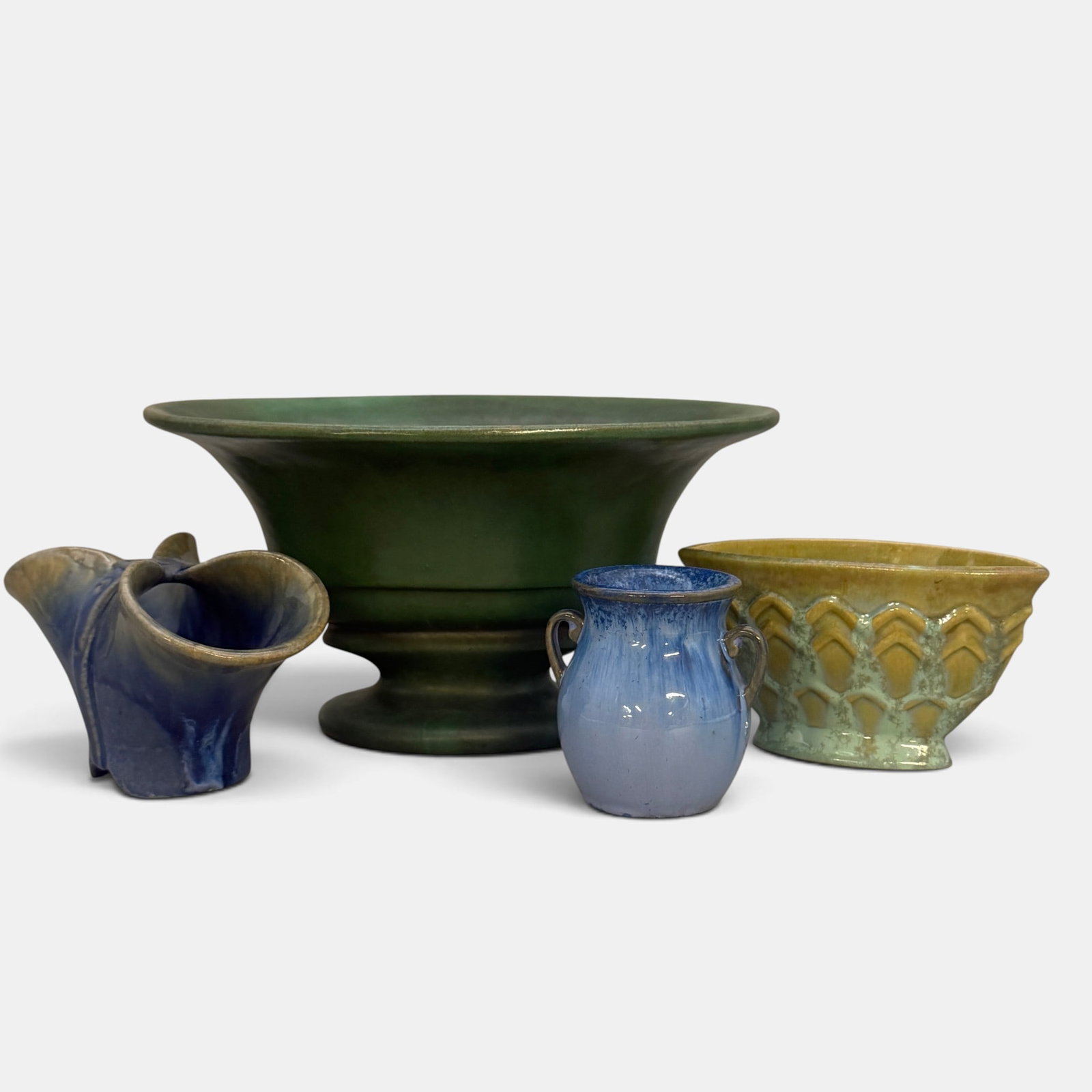Four Fulper items, three bowls and one vase: Four Fulper items. 1. Large oval bowl with iridescent green glaze, vertical inkstamp. Height 6 inches, length 11 1/4 inches. 2. Small blue crystaline vase with two loop handles. Horizontal FULPER