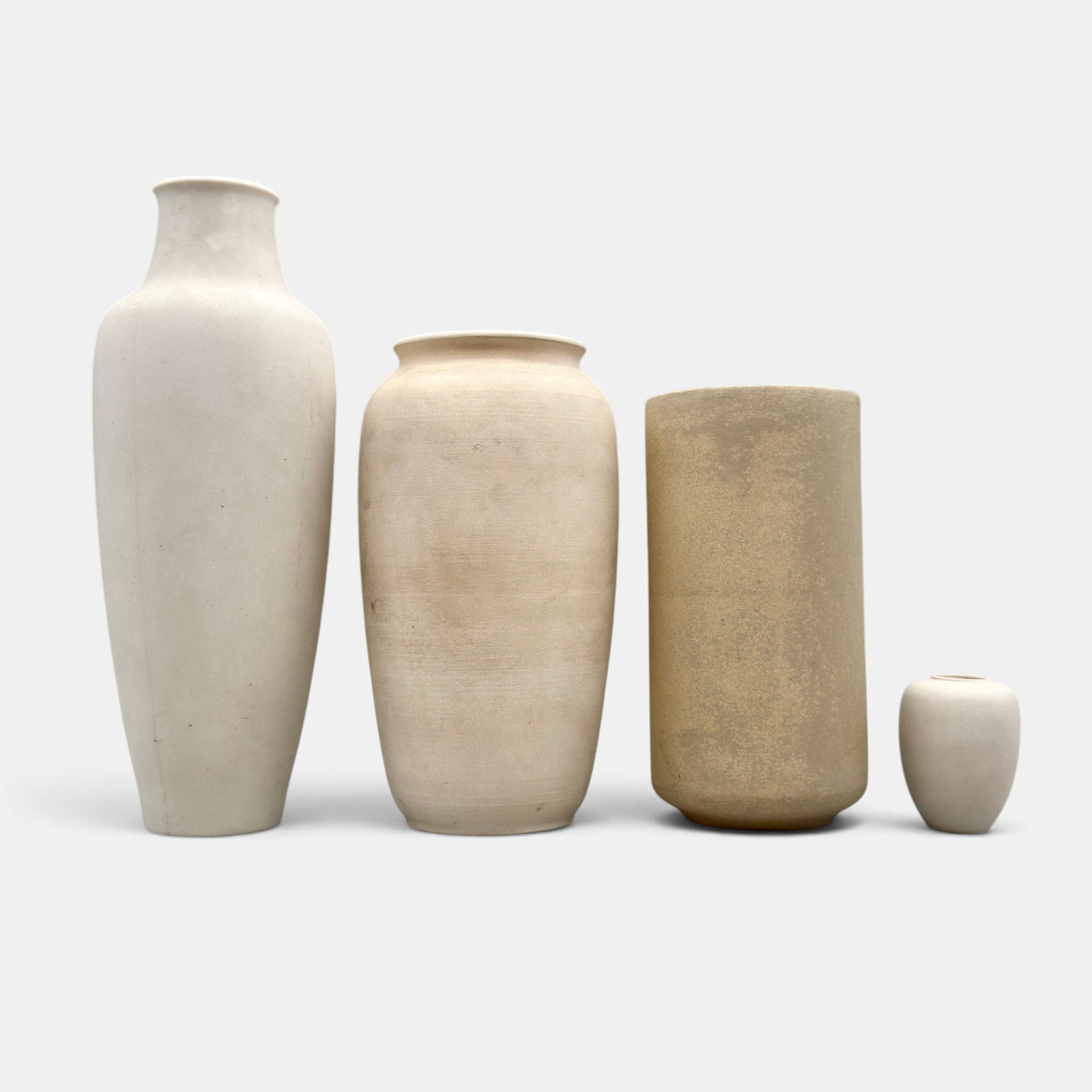 Four undecorated University City porcelain vases: Four undecorated University City porcelain vases. Three are marked in green slip, "UC 1914 TD" and the third is impressed UC 1913. Height of the tallest is 9 7/8 inches. Doat supposed left University 