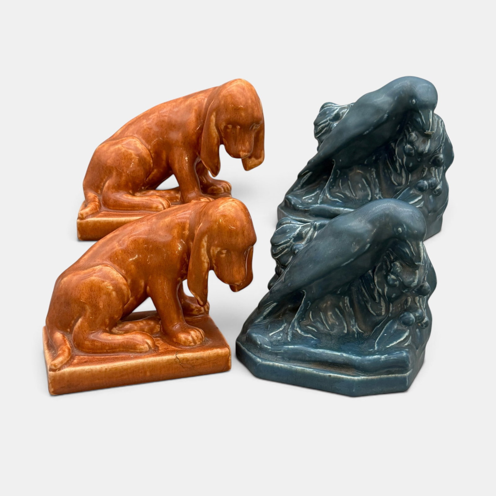 Two pair of Rookwod bookends, Hound Dogs and Rooks.: Two sets of Rookwood bookends, Hound Dogs from 1928 and Rooks from 1922. Impressed Rookwood logos, dates and shape numbers. Height of the Rooks, 5 1/8 inches, height of the dogs, 5 1/8 inches.