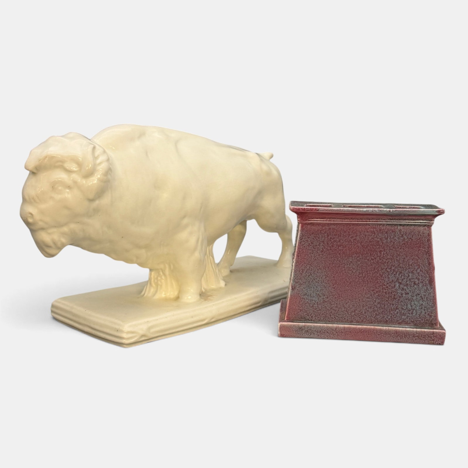 Large Ceramic Buffalo and a Mosaic advertising item: Two iitems. 1. Large ceramic Buffalo. Unmarked. Height 7 7/8 inches, length 13 3/4 inches, 2, Mosaic Tile Company advertising item in the form of a fireplace and surround. Marked on each side, "The Mo