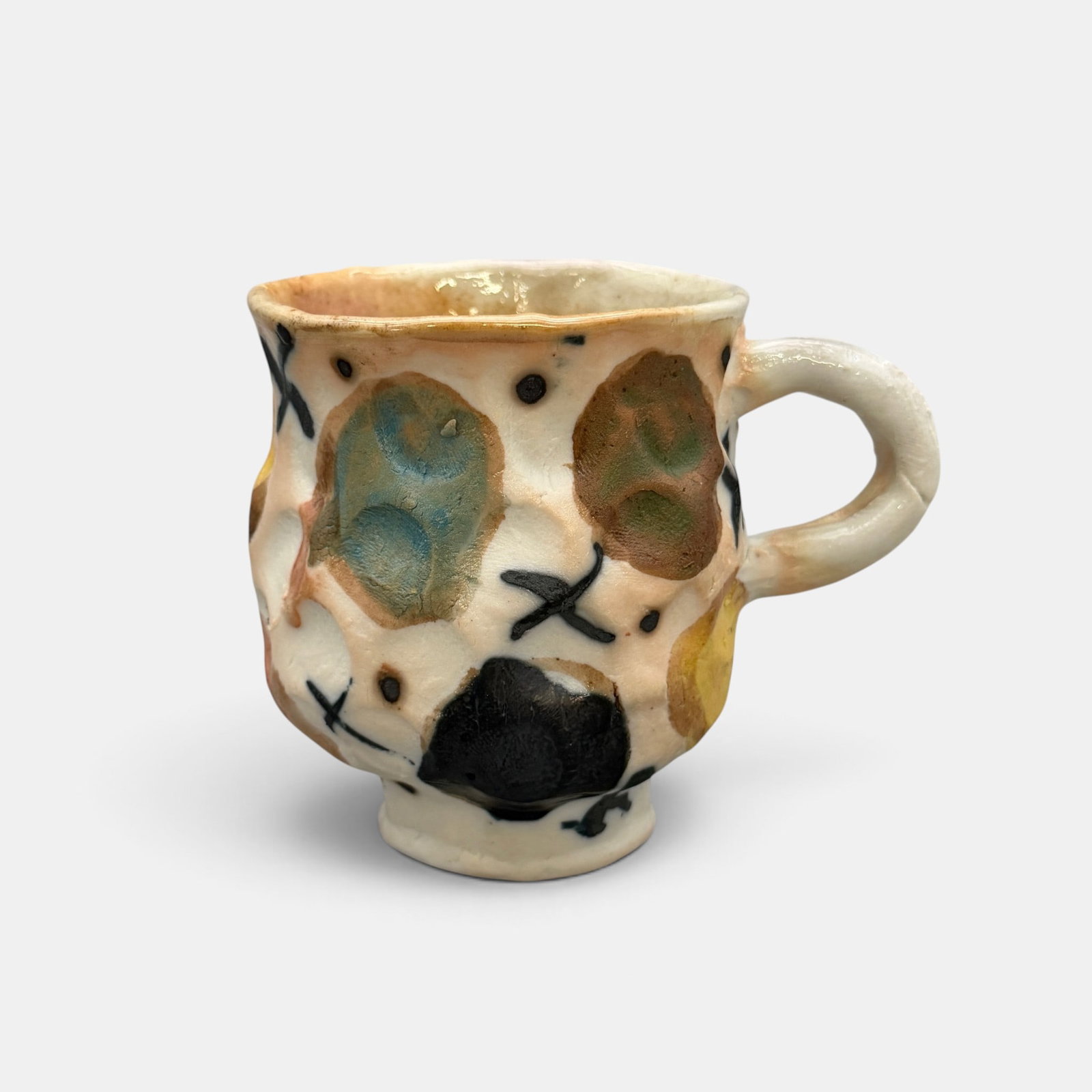 Arnie Zimmerman colorful mug, fruit, 2014: Arnie Zimmerman colorful mug with what appears to be a variety of fruit. Incised AZ mark with 14 for date. Height 3 34 inches.