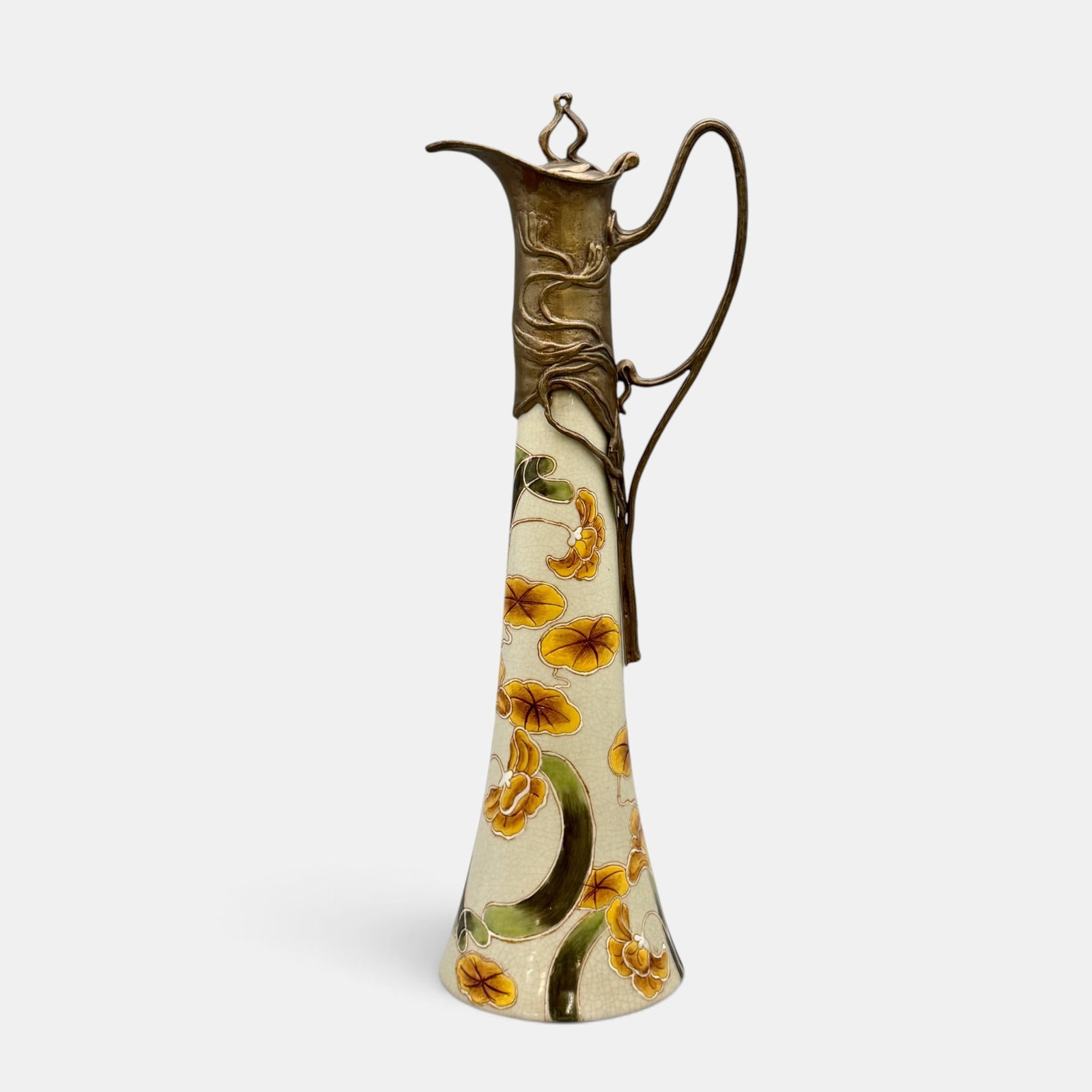 Wong Lee Modern Day Ceramic Ewer with pewter mounts: Wong Lee modern day Art Nouveau ceramic interpretation, featuring stylized flowers and leaves with pewter mounts. Marked on the bottom with Art Nouveau appearing design including the initials M.T.P.