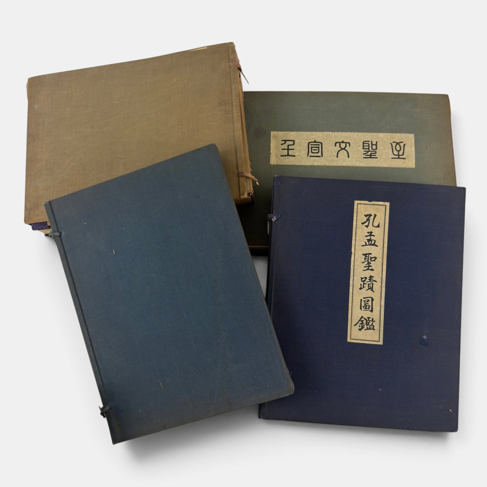 Group of Japanese Albums and Books: Including an early 20th century photograph album, an artist's watercolor album, and several art books, nicely bound in covers.