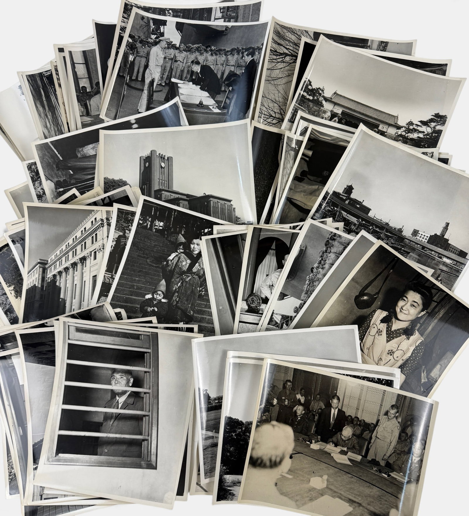 Press Photograph Archive of WWII Japanese Surrender: A substantial photograph archive, all pertaining to Japan toward the end of the war, with several seemingly unpublished images of MacArthur, Japan, and several published images of the Surrender