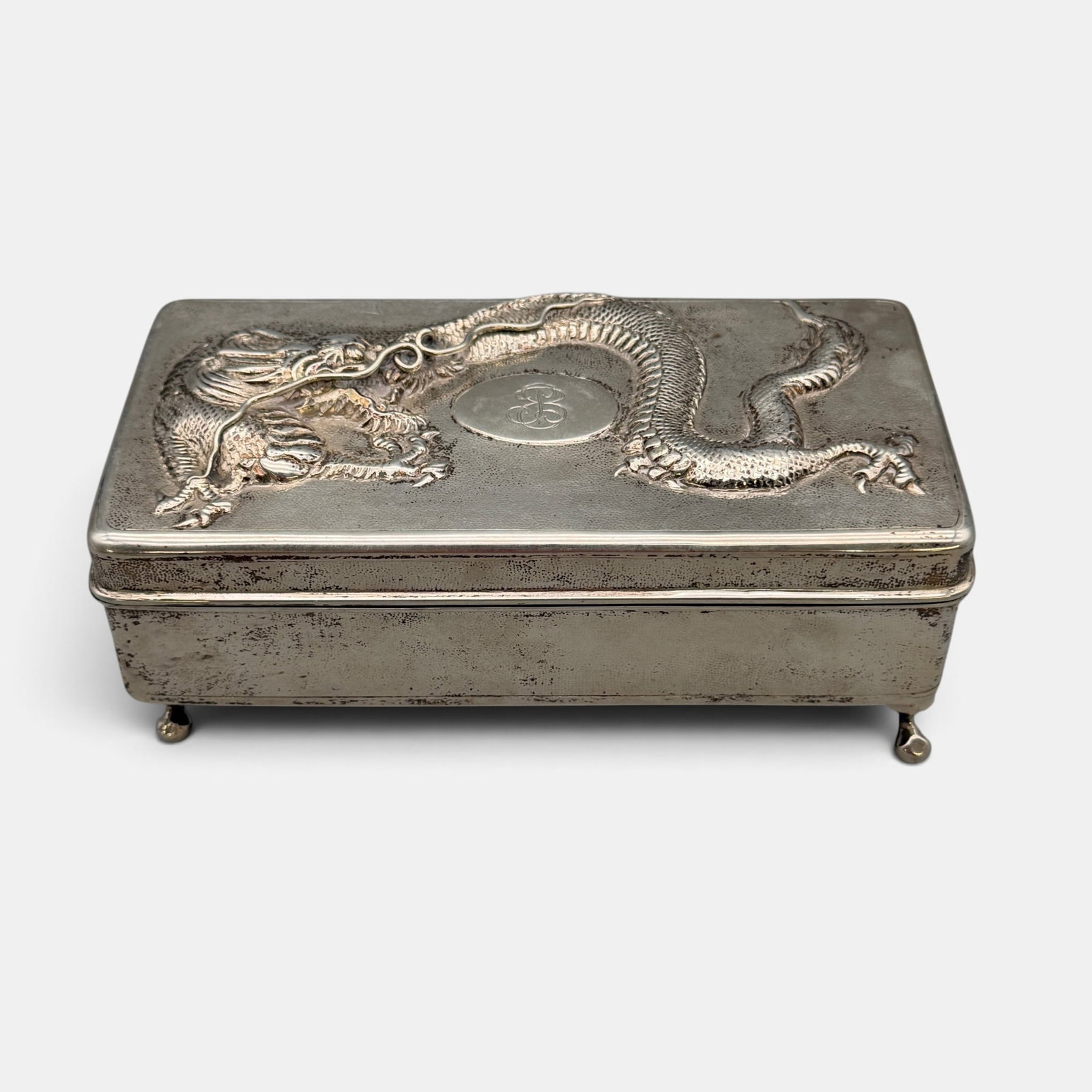Sterling Silver Jewelry Box with Dragon Decoration: Marked to underside and marked by maker "HK". Inside lined with pink velvet. Total weight: 16.48 troy ounces