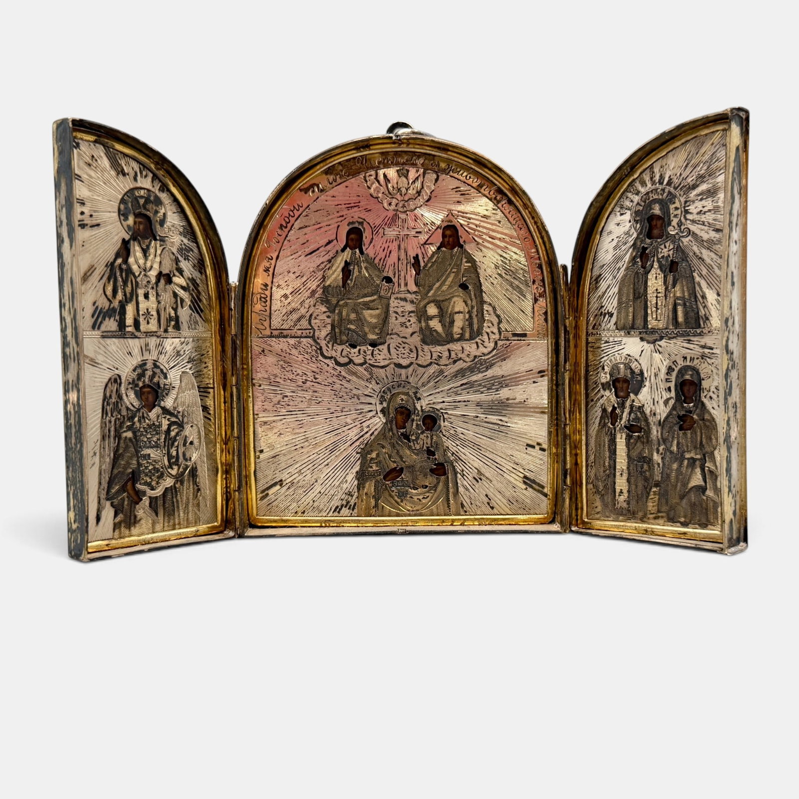 19th Century Russian Silver Triptych Icon: 19th century, a triptych folding icon, all sides with Russian assayer marking, revealing three scene with silver overlay. Total weight 13.33 ozt. Ht. 4.5".