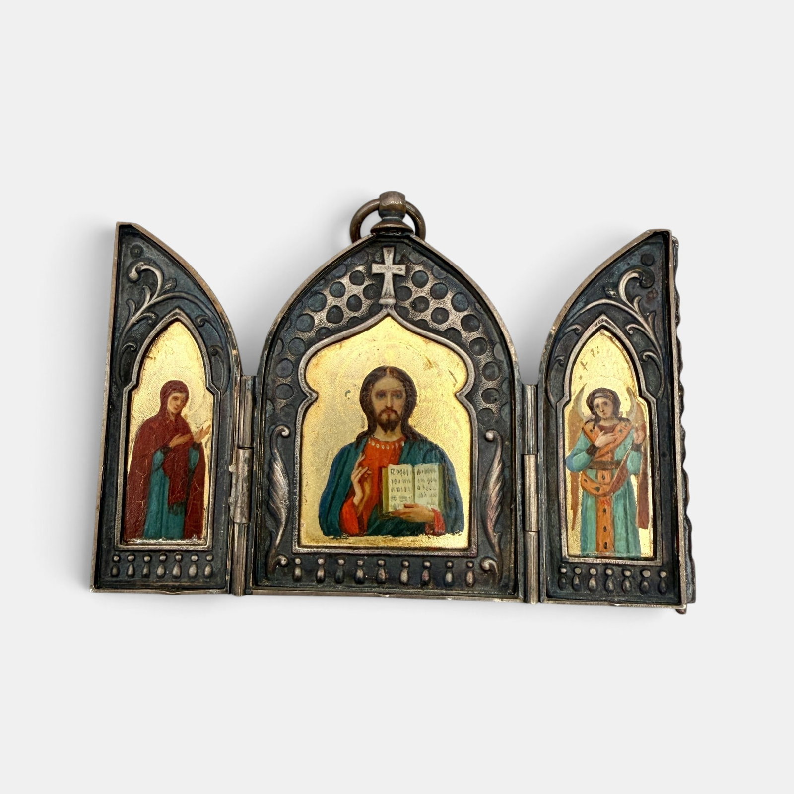 Russian Triptych Icon in 875 Silver: A triptych Russian icon, marked on the reverse for 84 Russian silver and 14k gold. 2 3/8" ht. x 3.5" wd.