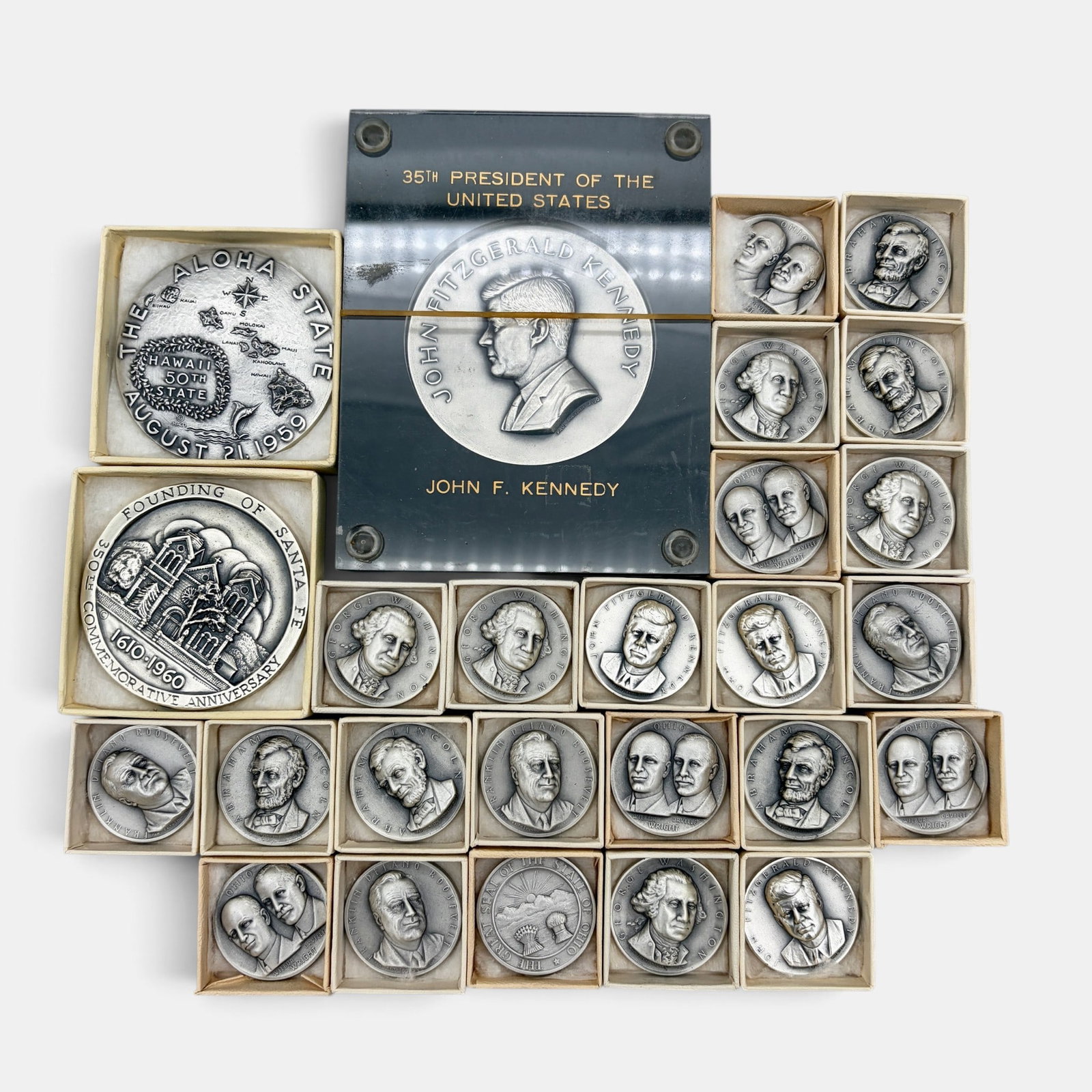 Collection of Pure Silver or Sterling Commemorative Medals: Including a large JFK, Wright Brothers, FDR, and others, 26 medals in total, each marked to the side.