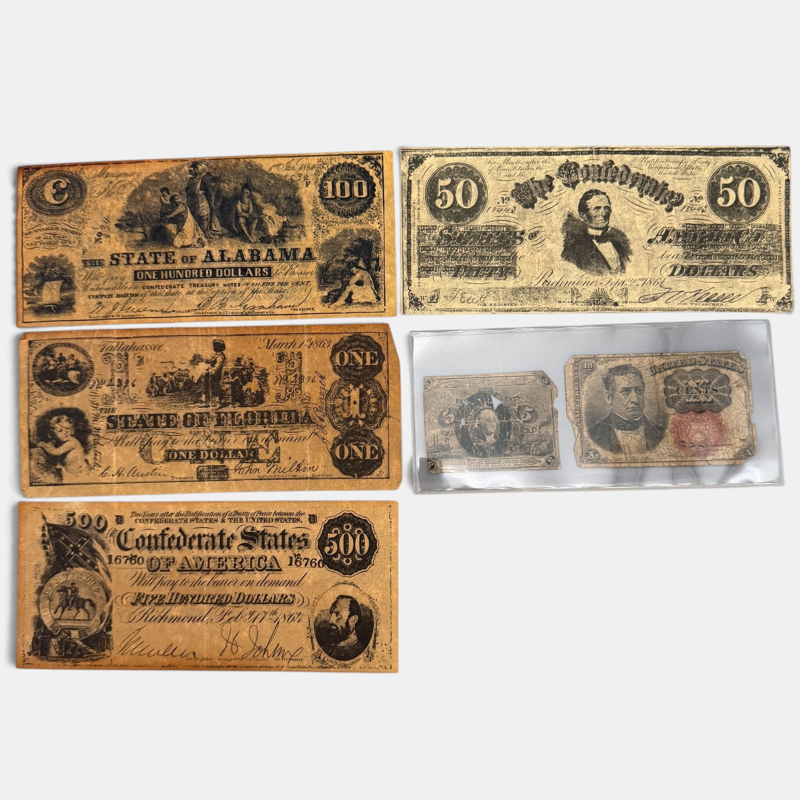 Collection of Early Confederate and State Currency: One 1864 $50 confederate bill, one confederate $500 bill, one State of Florida $1, one State of Alabama $100, one Washington 5 cent note and one ten cent note.